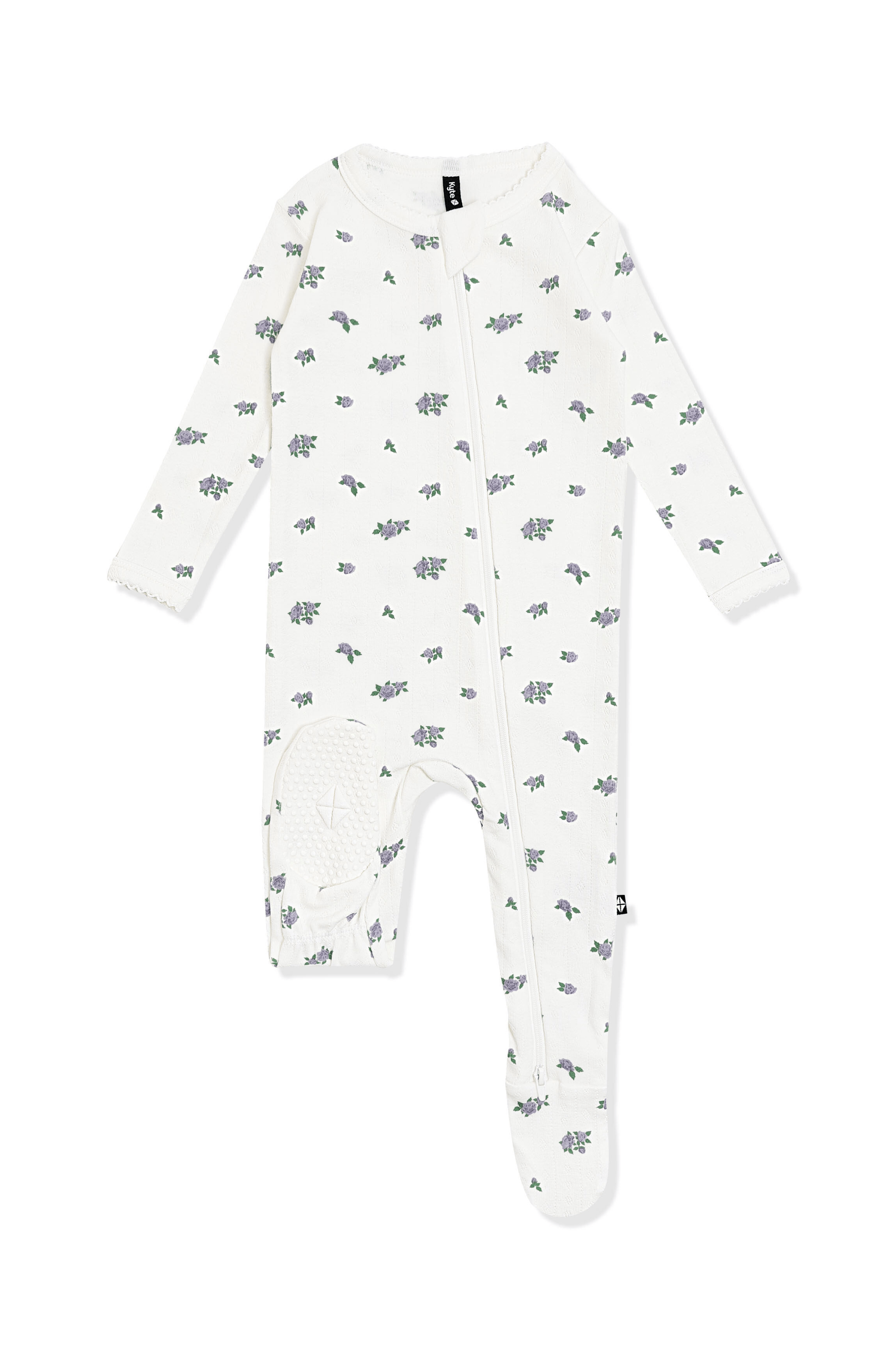 The bottom of the foot pad showing the kyte baby logo on the Pointelle Zippered Footie in Spray Rose with picot trim