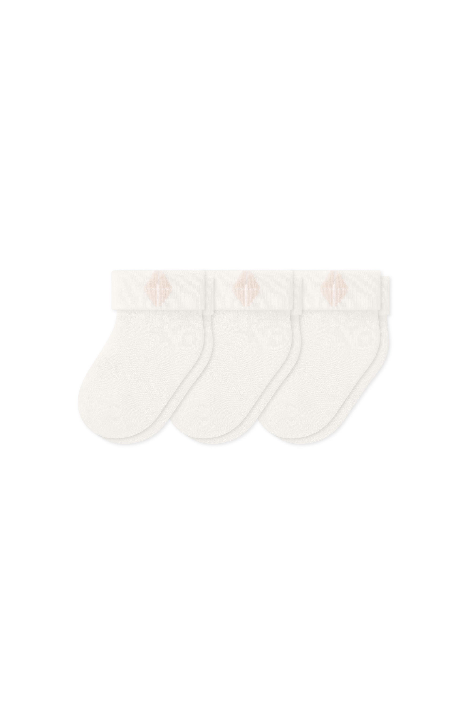 Three socks in Cloud laying flat on a white background.
