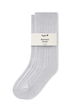 Knee high socks in storm laying flat on a white background.