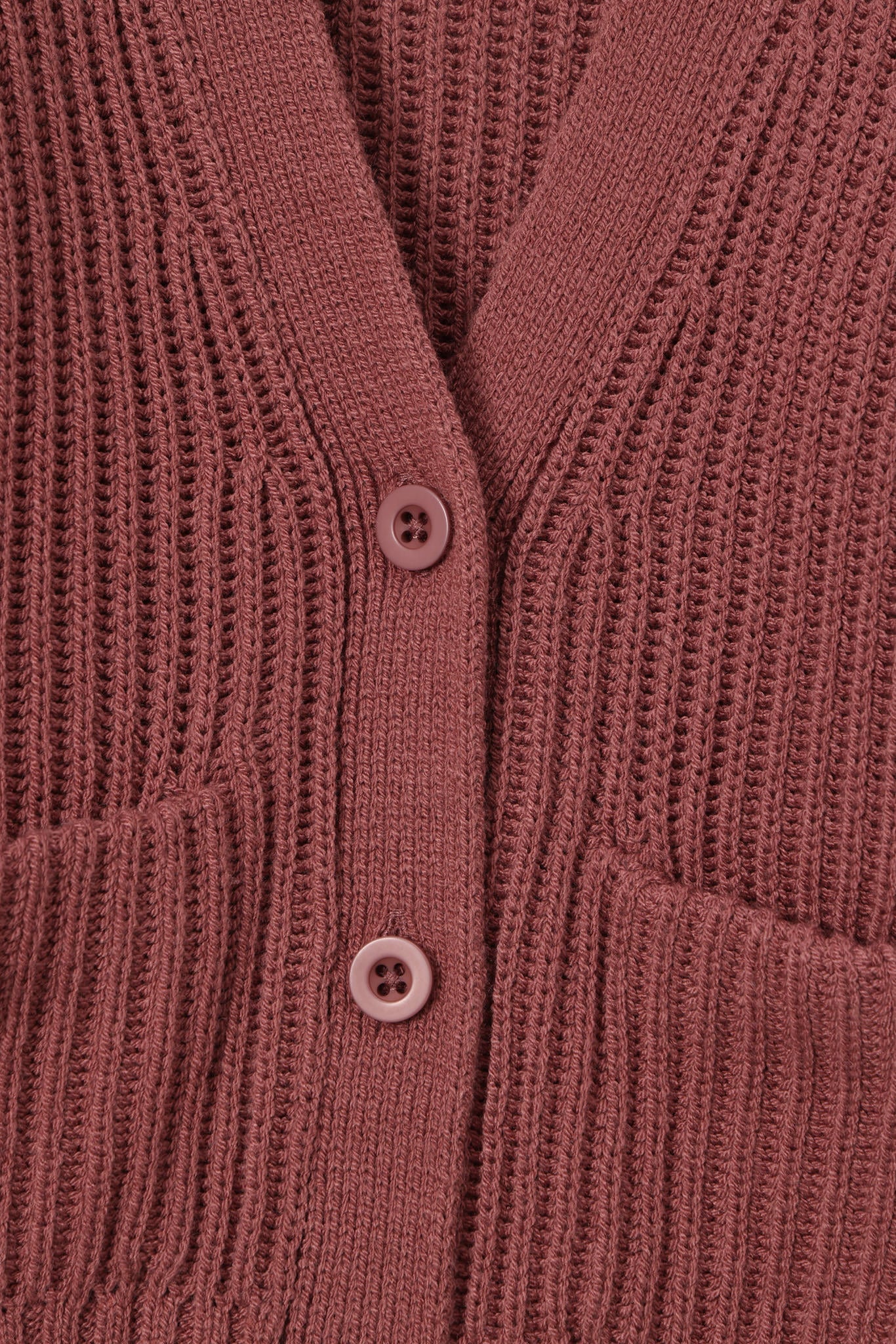 Close up of oversized ember cardigan with button closure