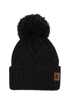Product photo of the Chunky Cable Knit Beanie in Midnight with the Kyte Baby vegan leather tag visible