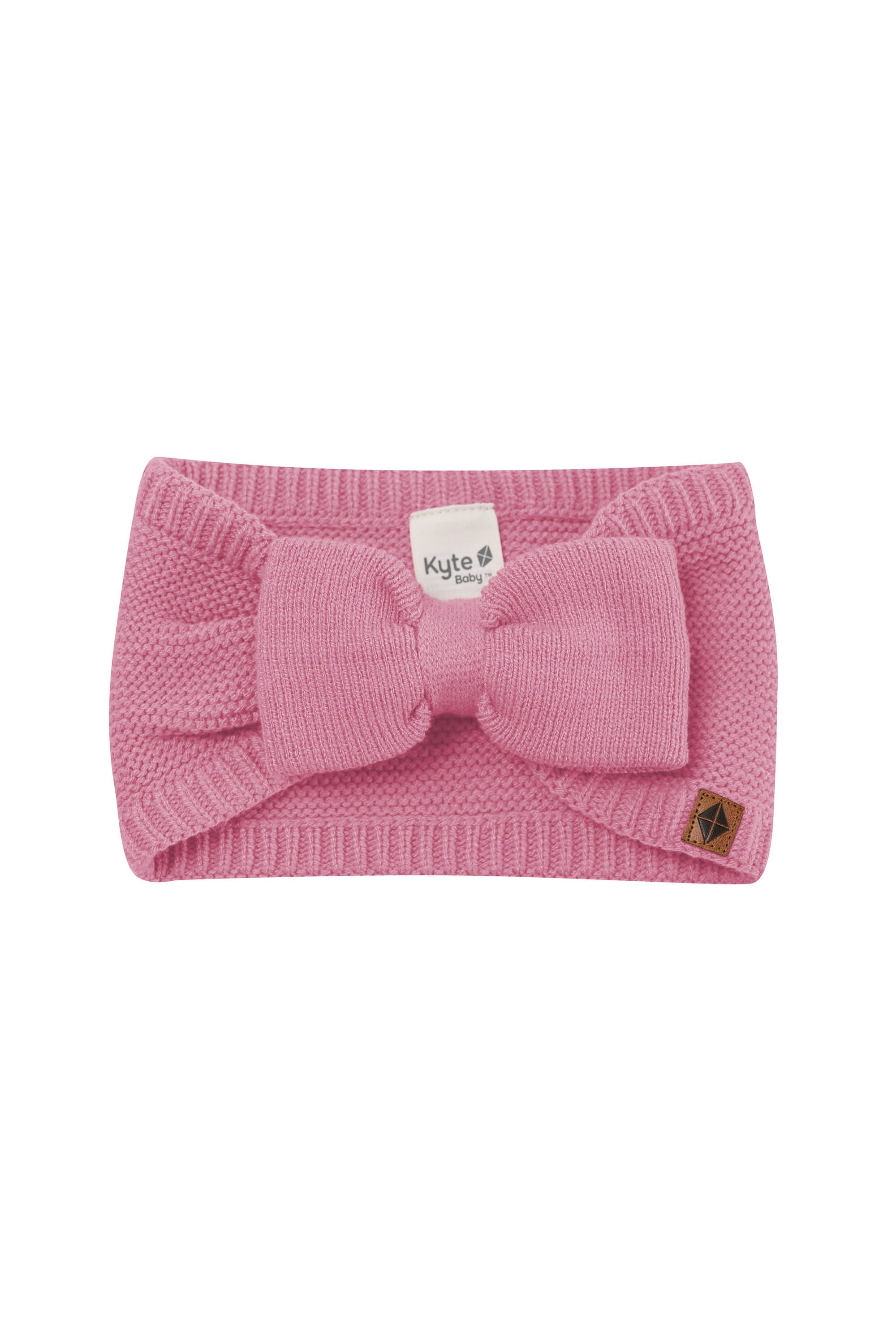 Product photo of the Chunky Knit Bow Headband in Apple Blossom with Kyte Baby vegan leather tag visible