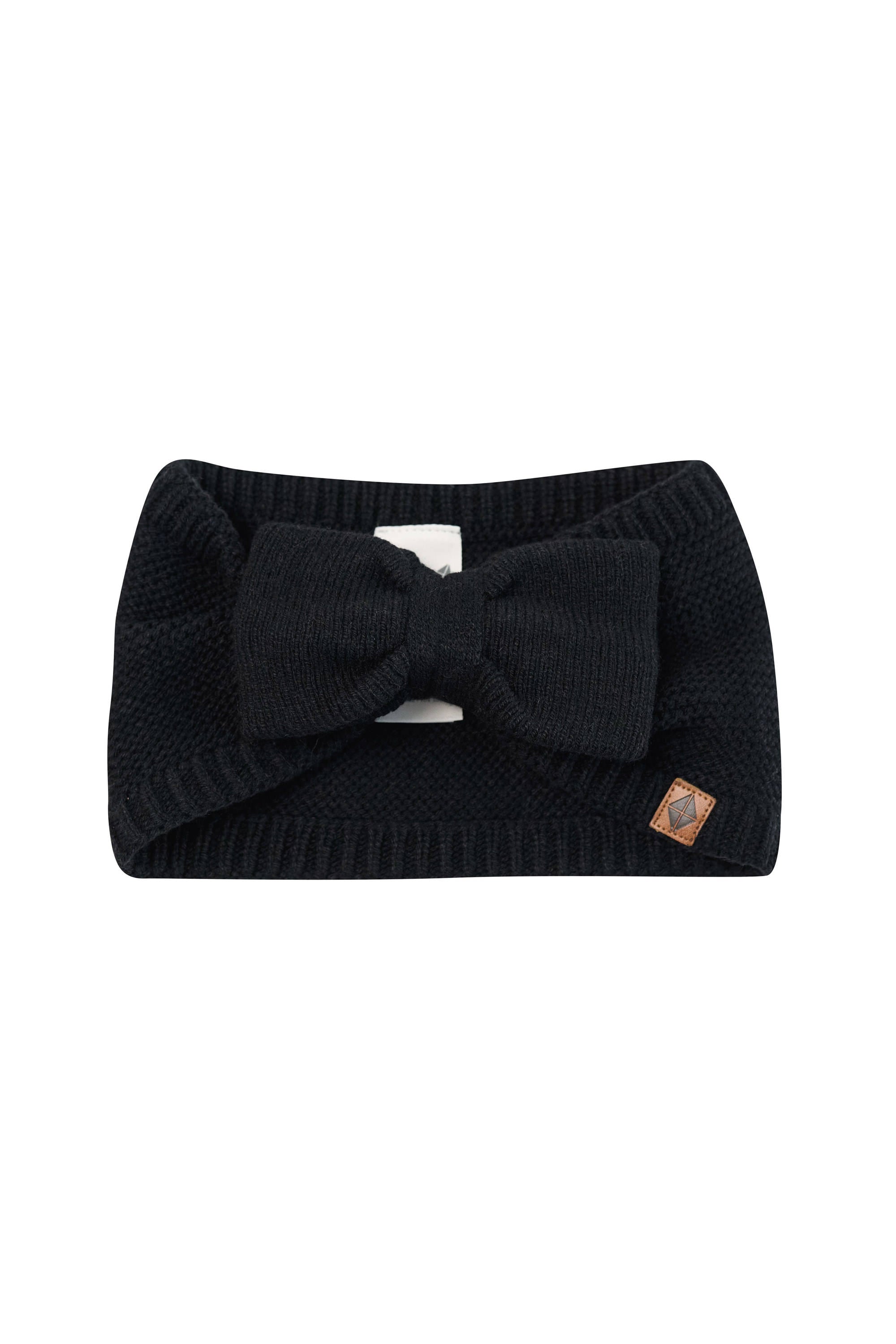 Product photo of the Chunky Knit Bow Headband in Midnight with the Kyte Baby vegan leather tag visible