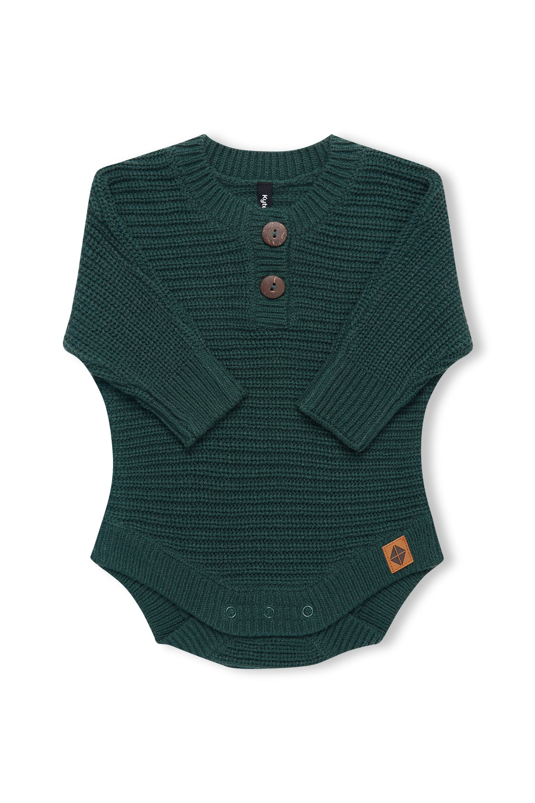 Chunky Knit Romper in cypress with folded sleeves on a white background