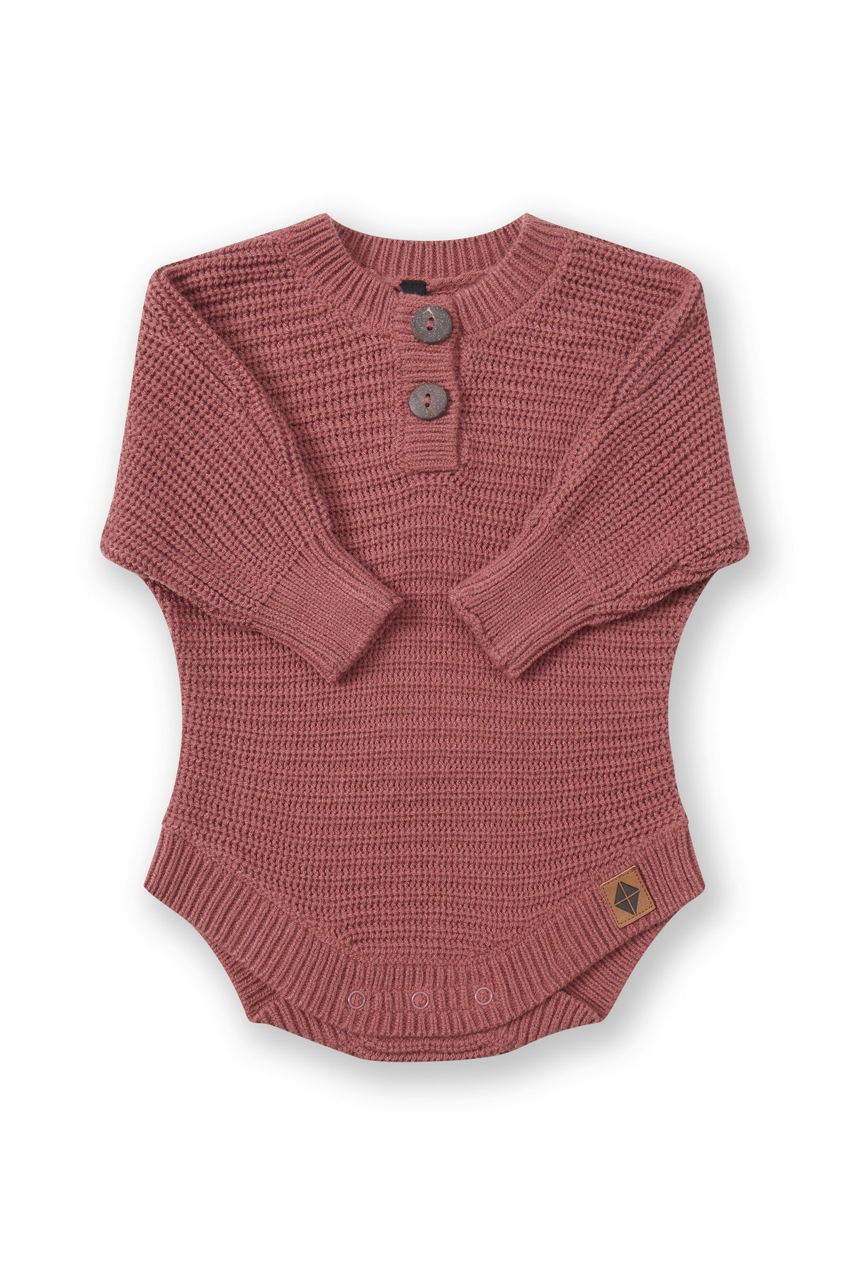 Chunky Knit Romper in Ember with folded sleeves on a white background