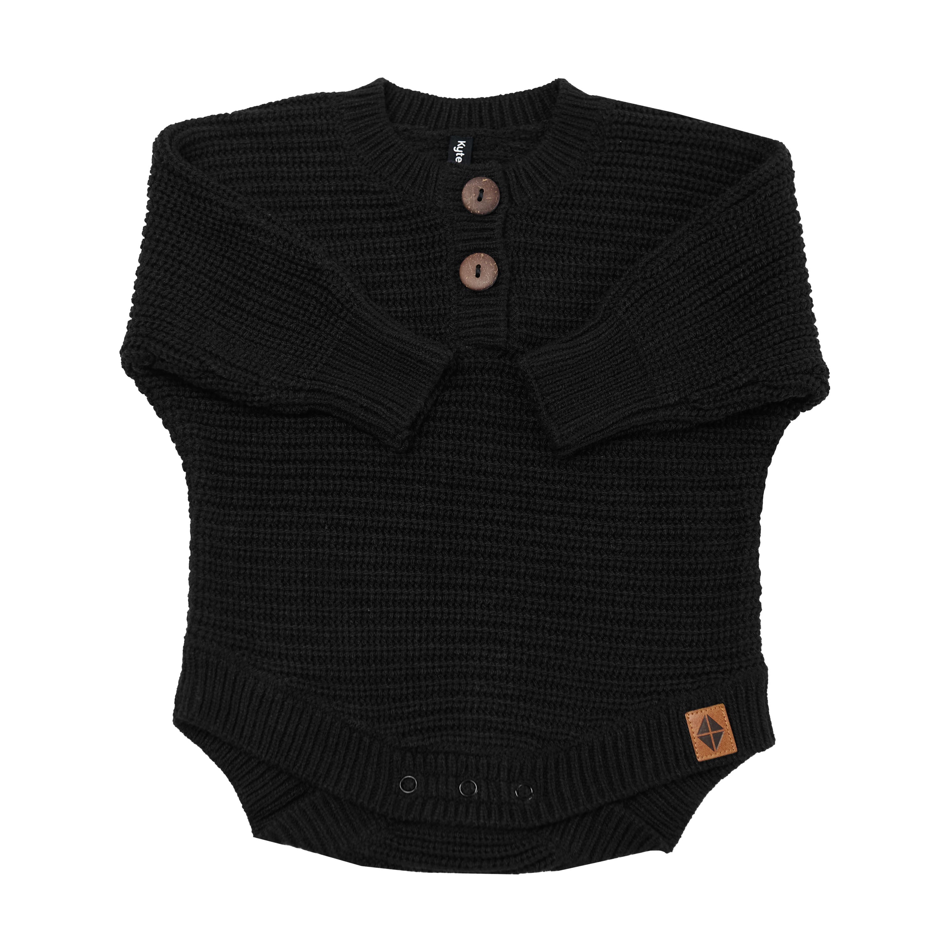 Chunky Knit Romper in Midnight shown with the arms folded inwards