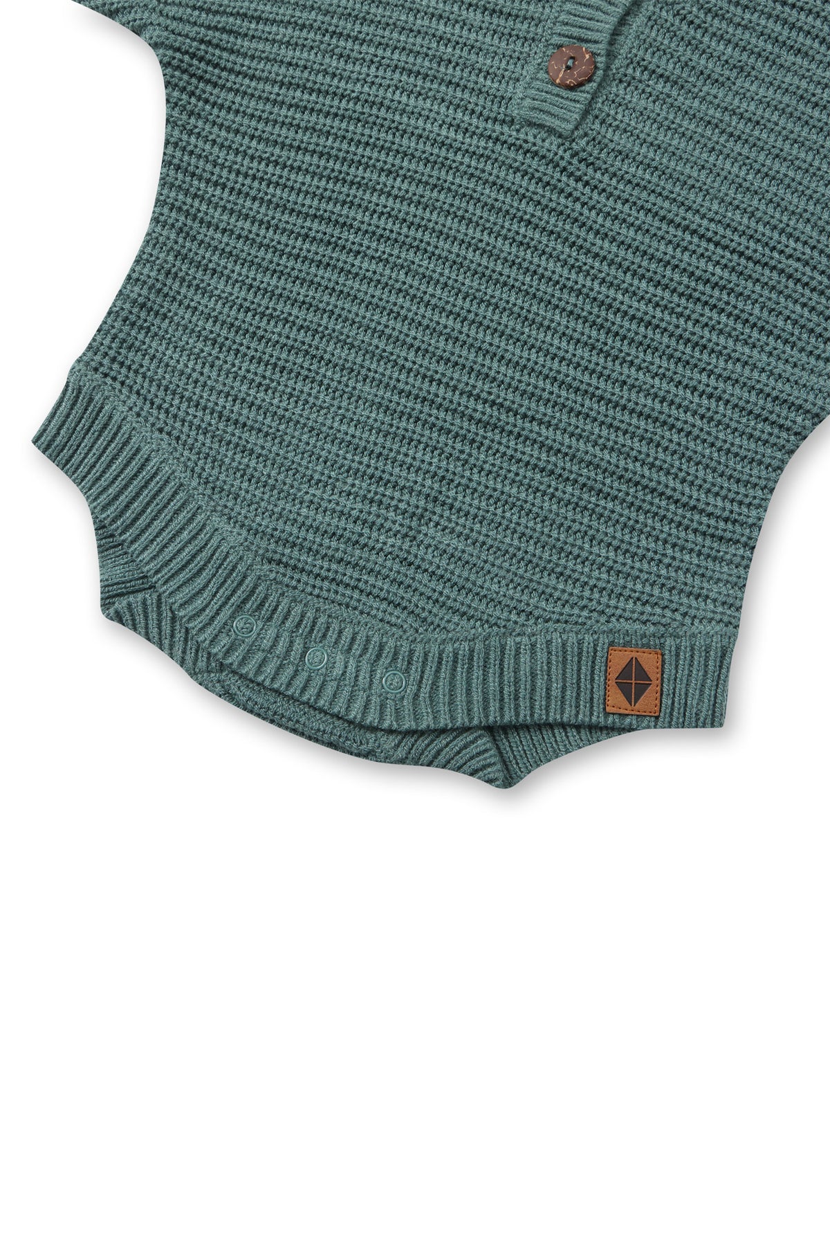 Bottom part of Chunky Knit Romper in Pine with snap buttons on a white background