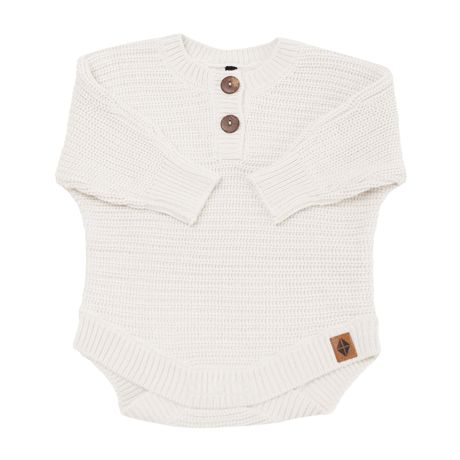 Chunky Knit Romper in Oat shown with arms folded inwards