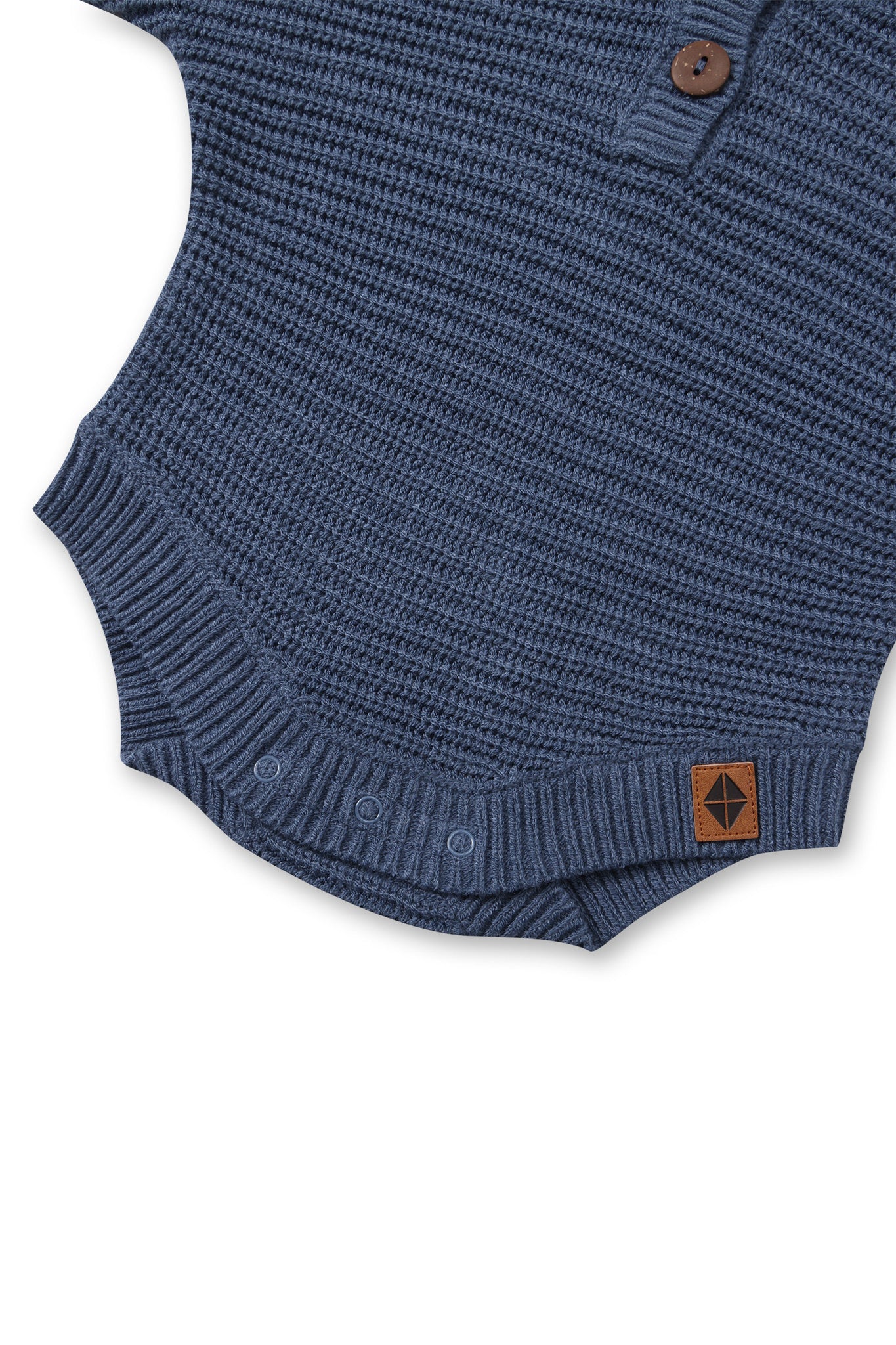 Bottom part of Chunky Knit Romper in Oxford with snap buttons on a white background
