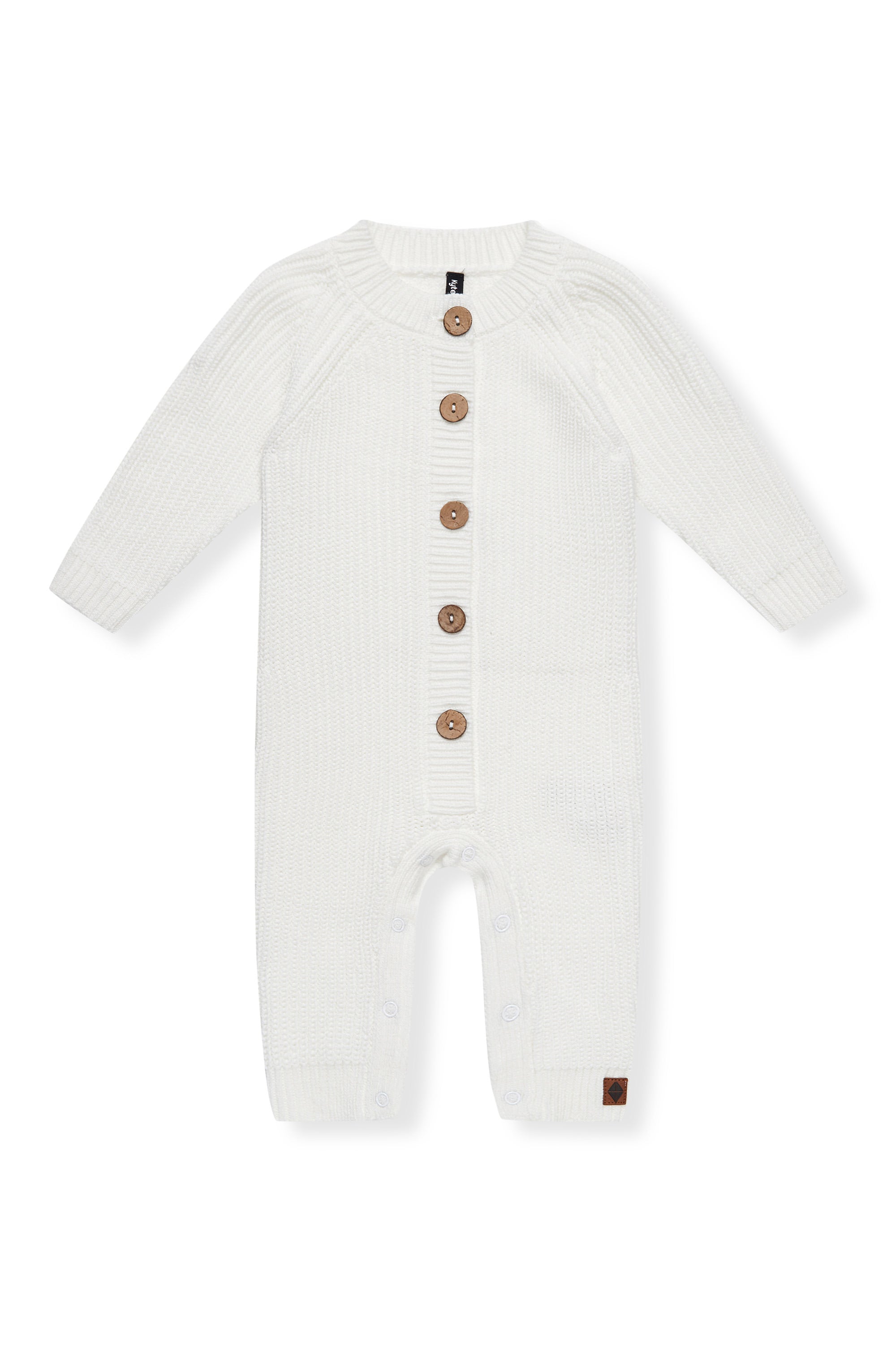 Chunky Knit Jumpsuit in Cloud with buttons on a white background