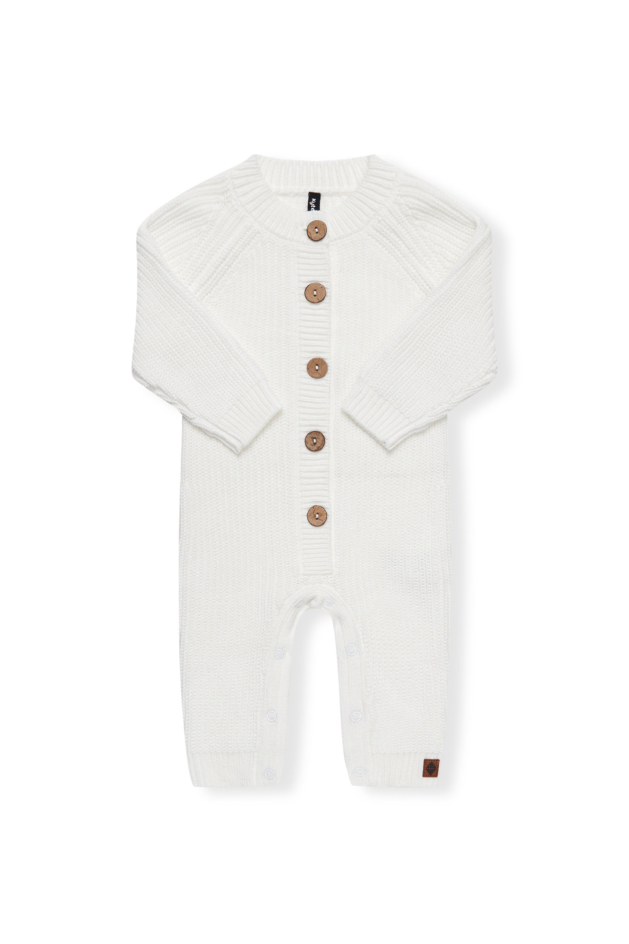 Chunky Knit Jumpsuit in cloud with folded sleeves on a white background