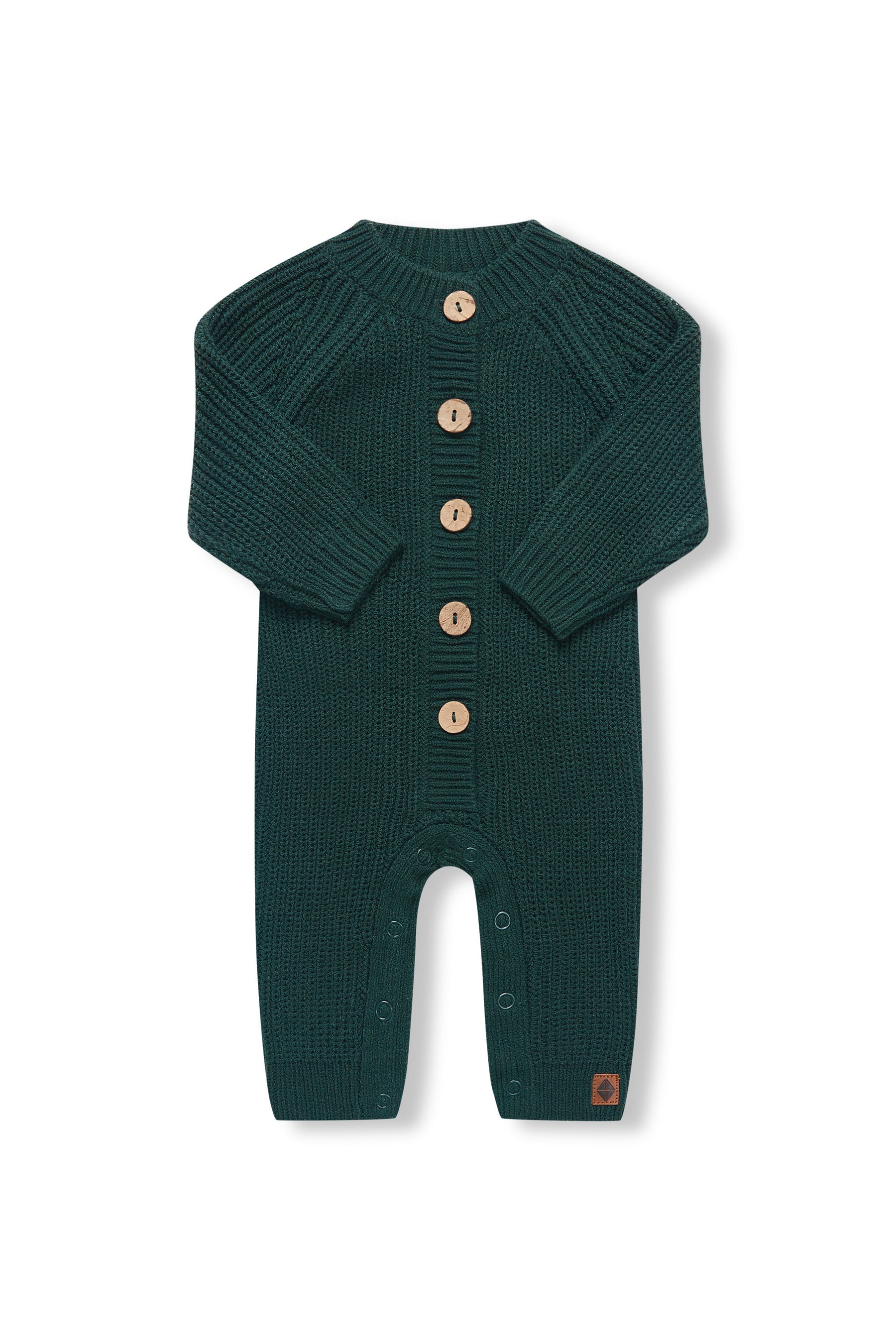 Chunky Knit Jumpsuit in cypress with folded sleeves on a white background
