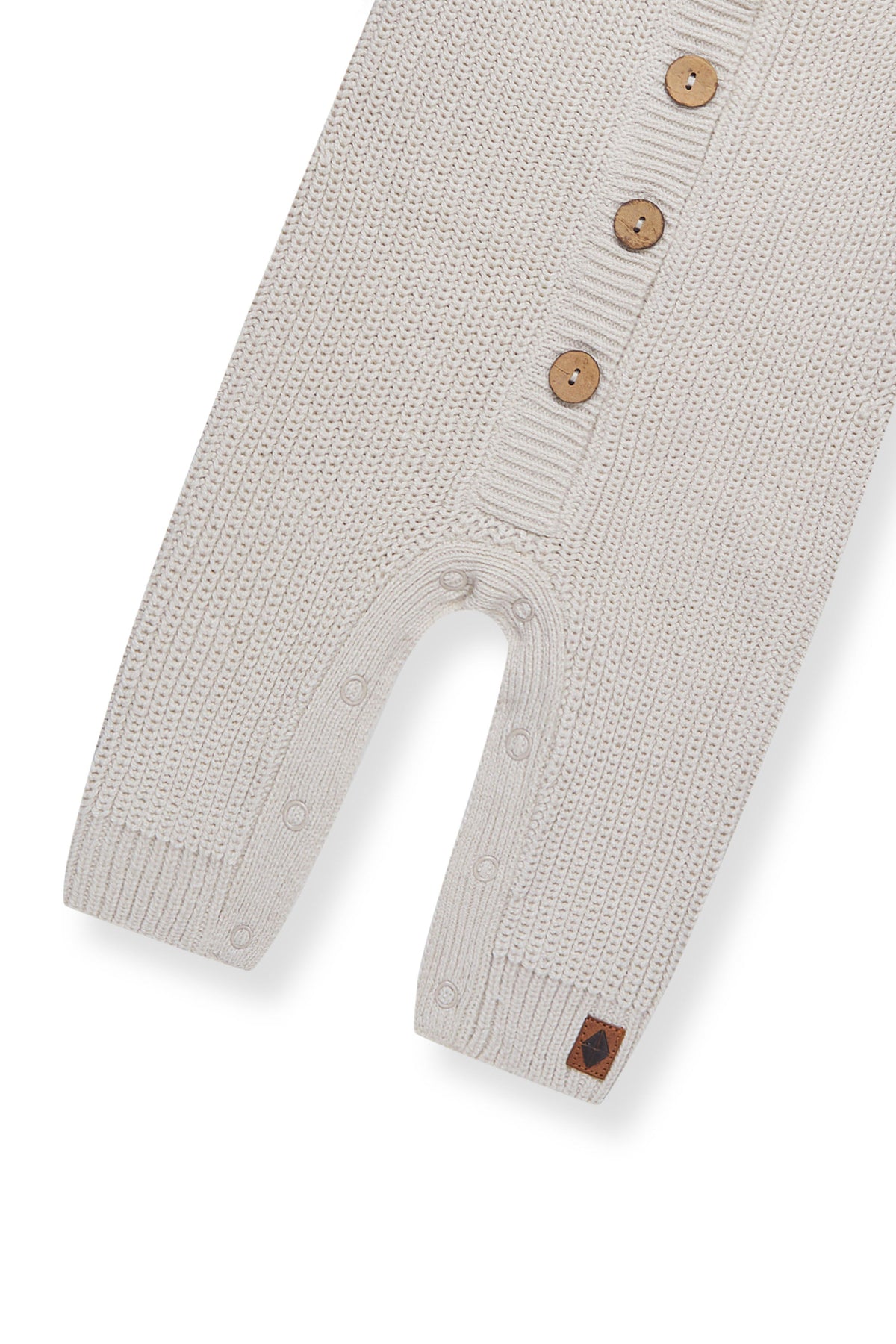 Bottom part of Chunky Knit Jumpsuit in oat on a white background