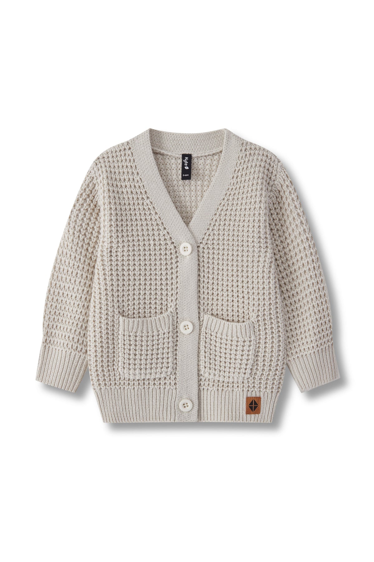 An oat textured knit cardigan sweater with a V-neck, three buttons, and two front patch pockets, shown flat on a white background.