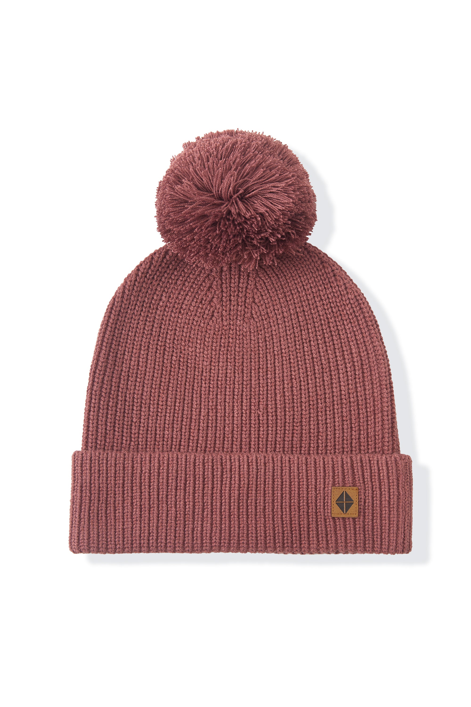 chunky knit beanie with pom in ember on a white background