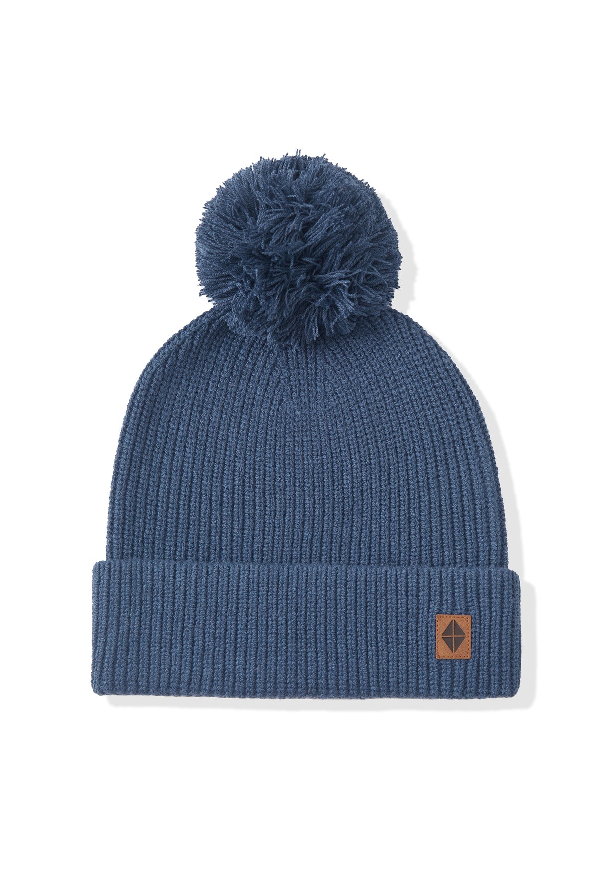 Blue knit beanie with pom on a white background
