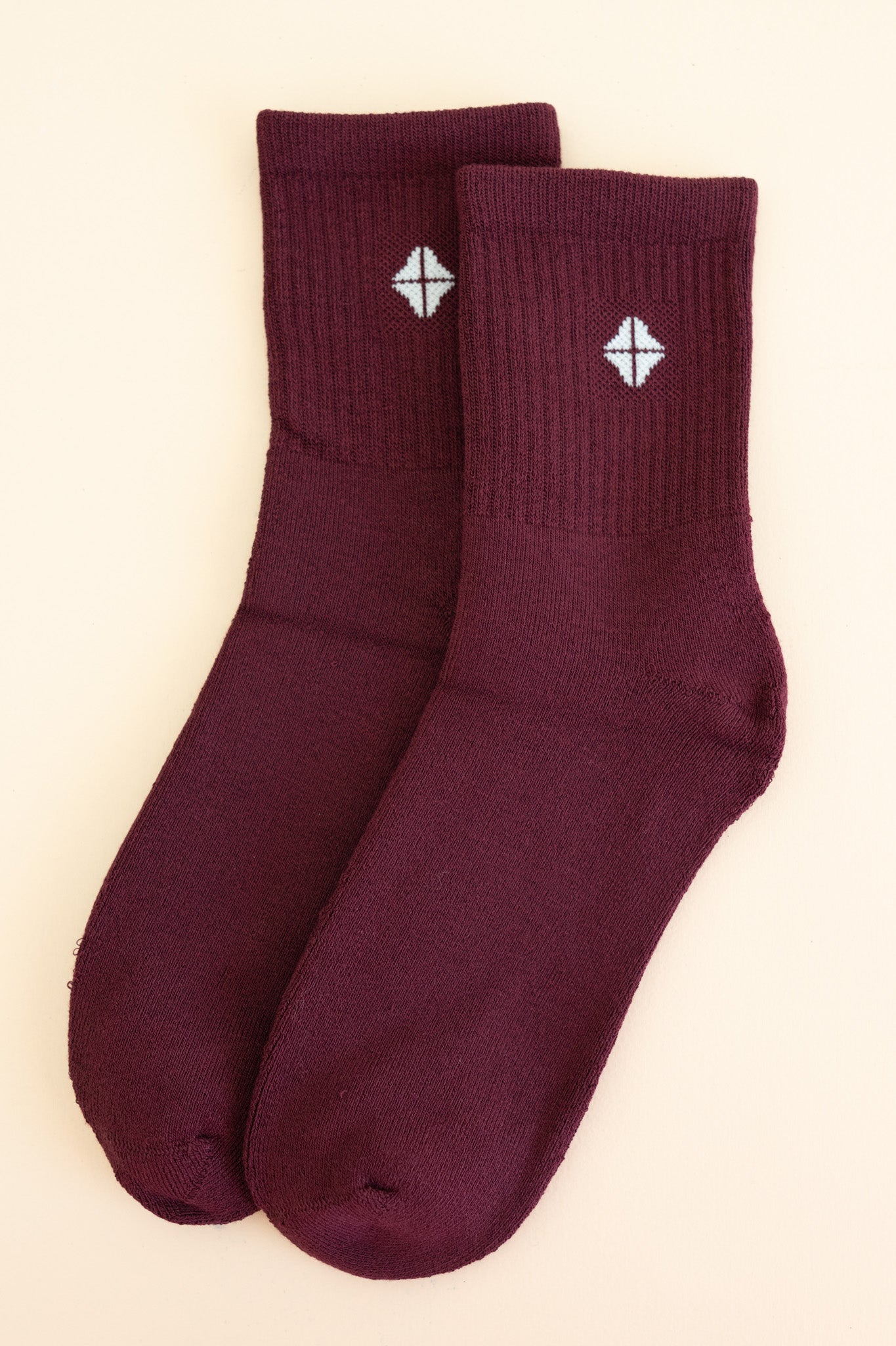 Adult Crew Socks in Burgundy shown side by side on a light neutral background