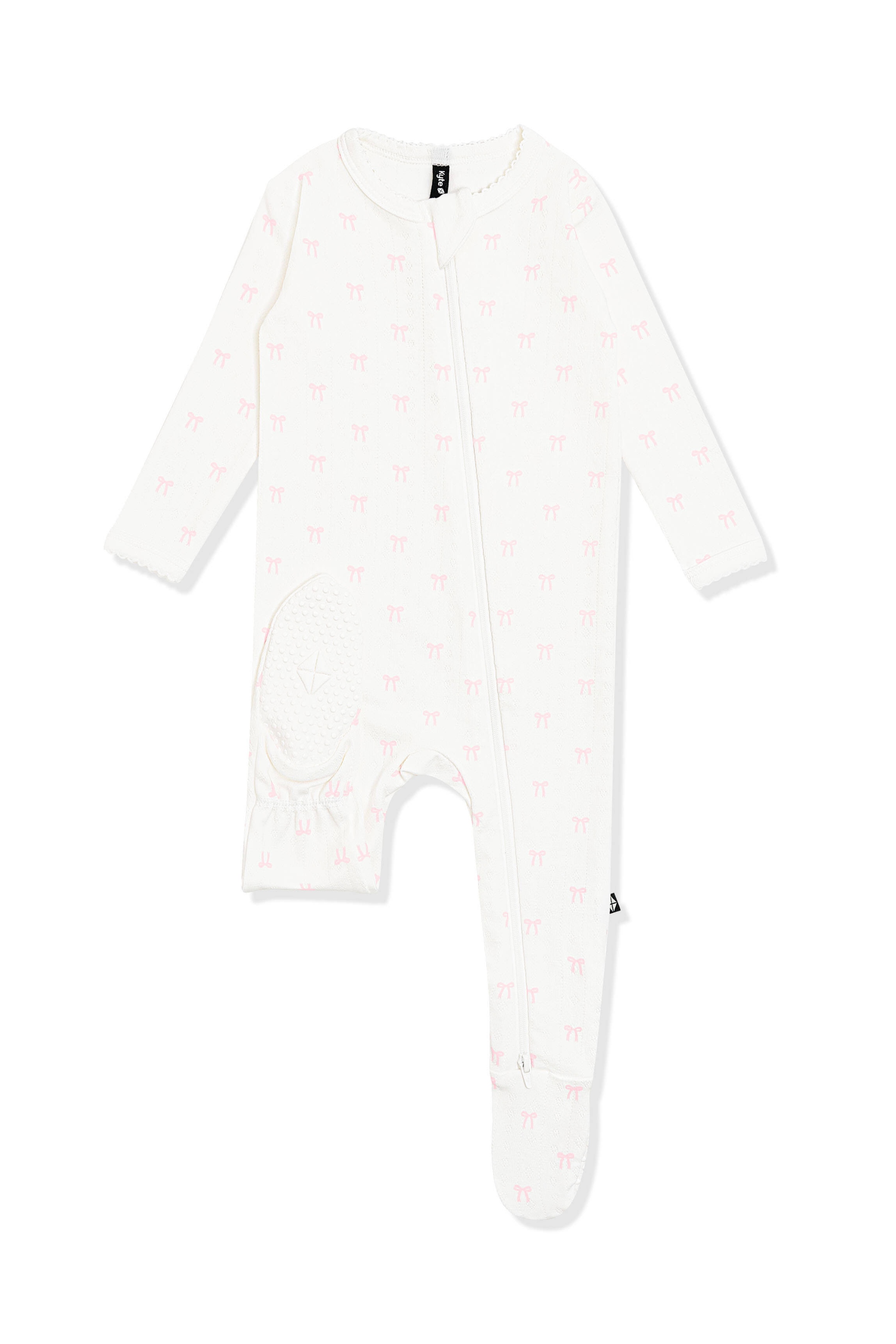 The bottom of the foot showing the kyte baby logo on the Pointelle Zippered Footie in Sweet Pink Bow