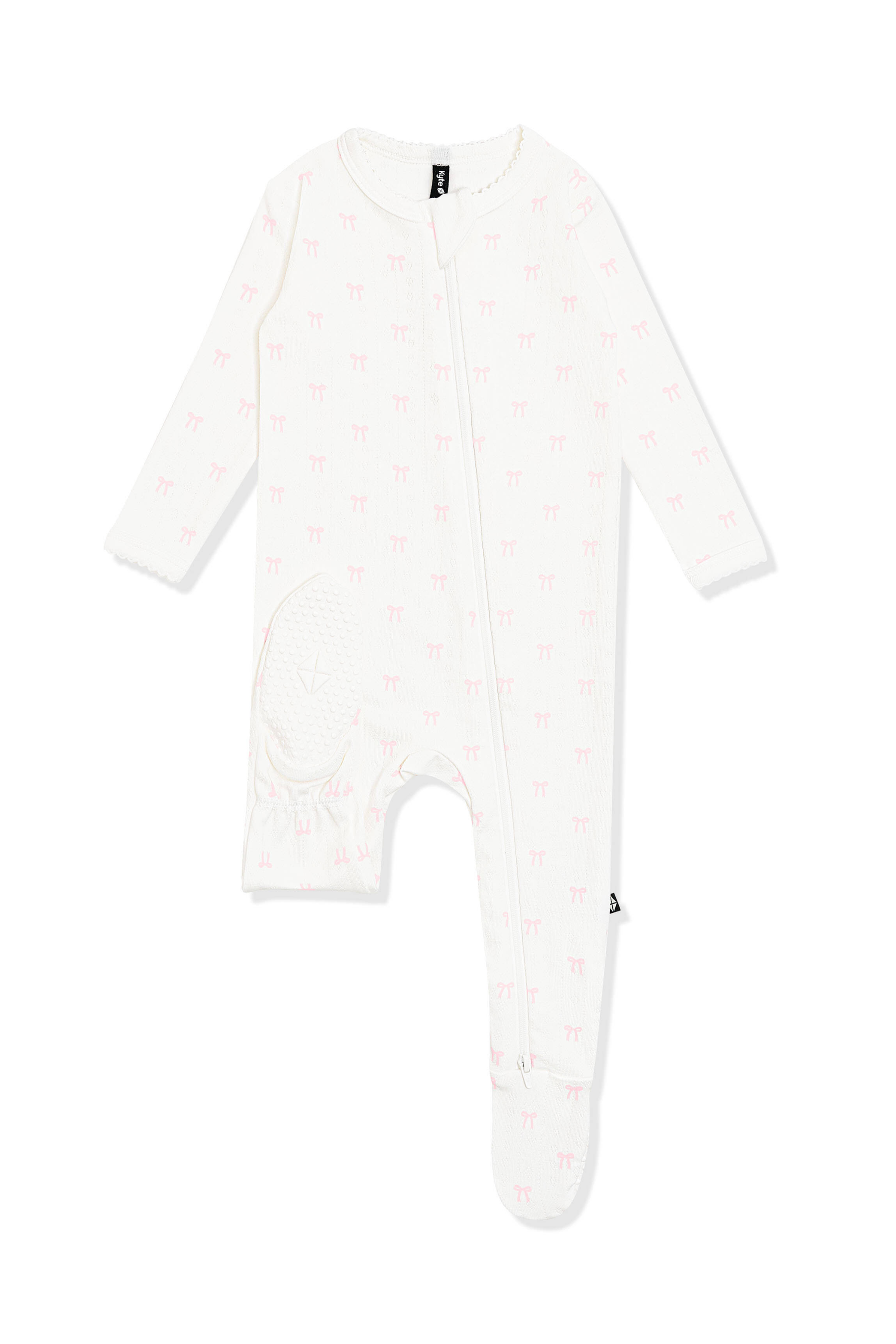 The bottom of the foot showing the kyte baby logo on the Pointelle Zippered Footie in Sweet Pink Bow
