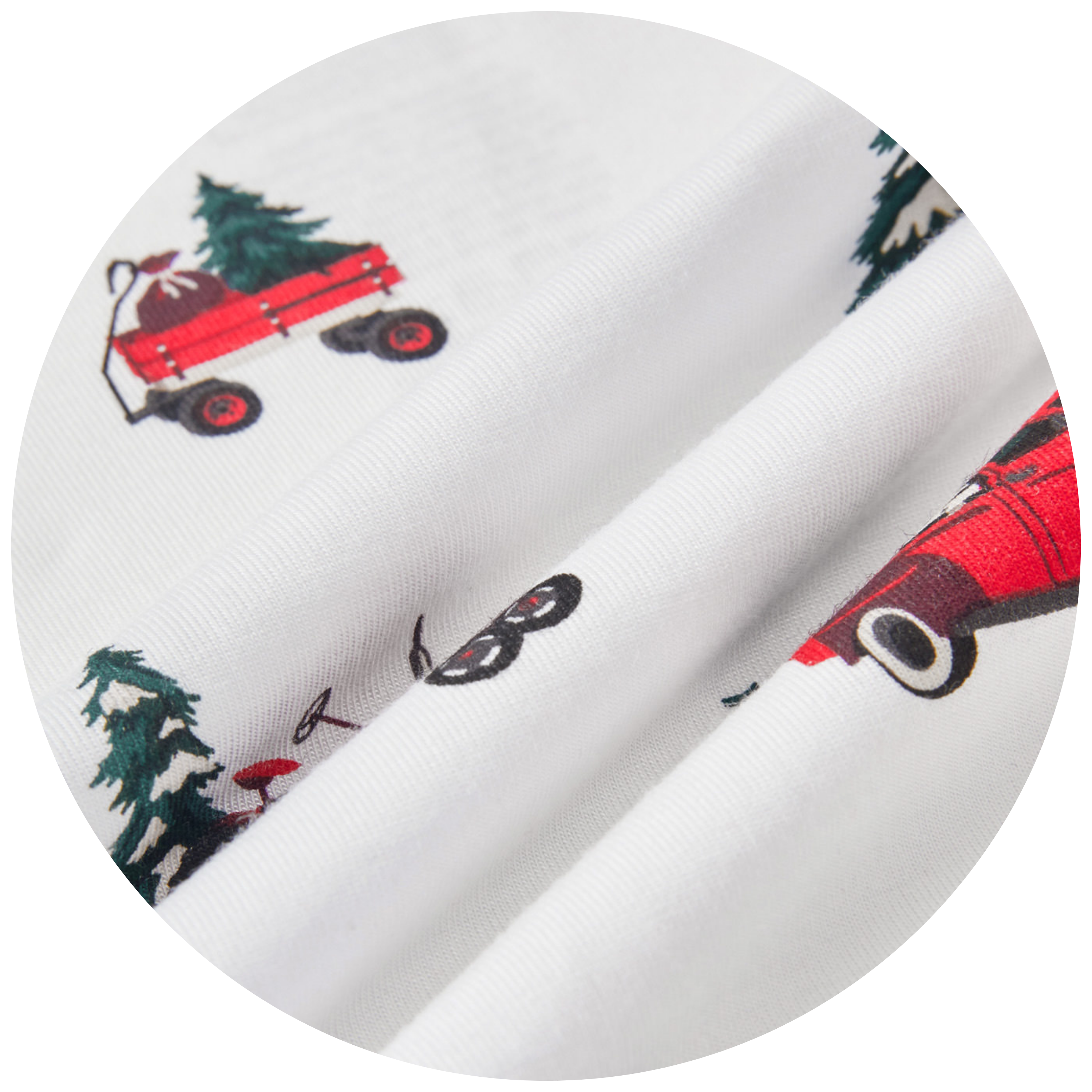 swatch of white fabric with red vehicles and christmas treees