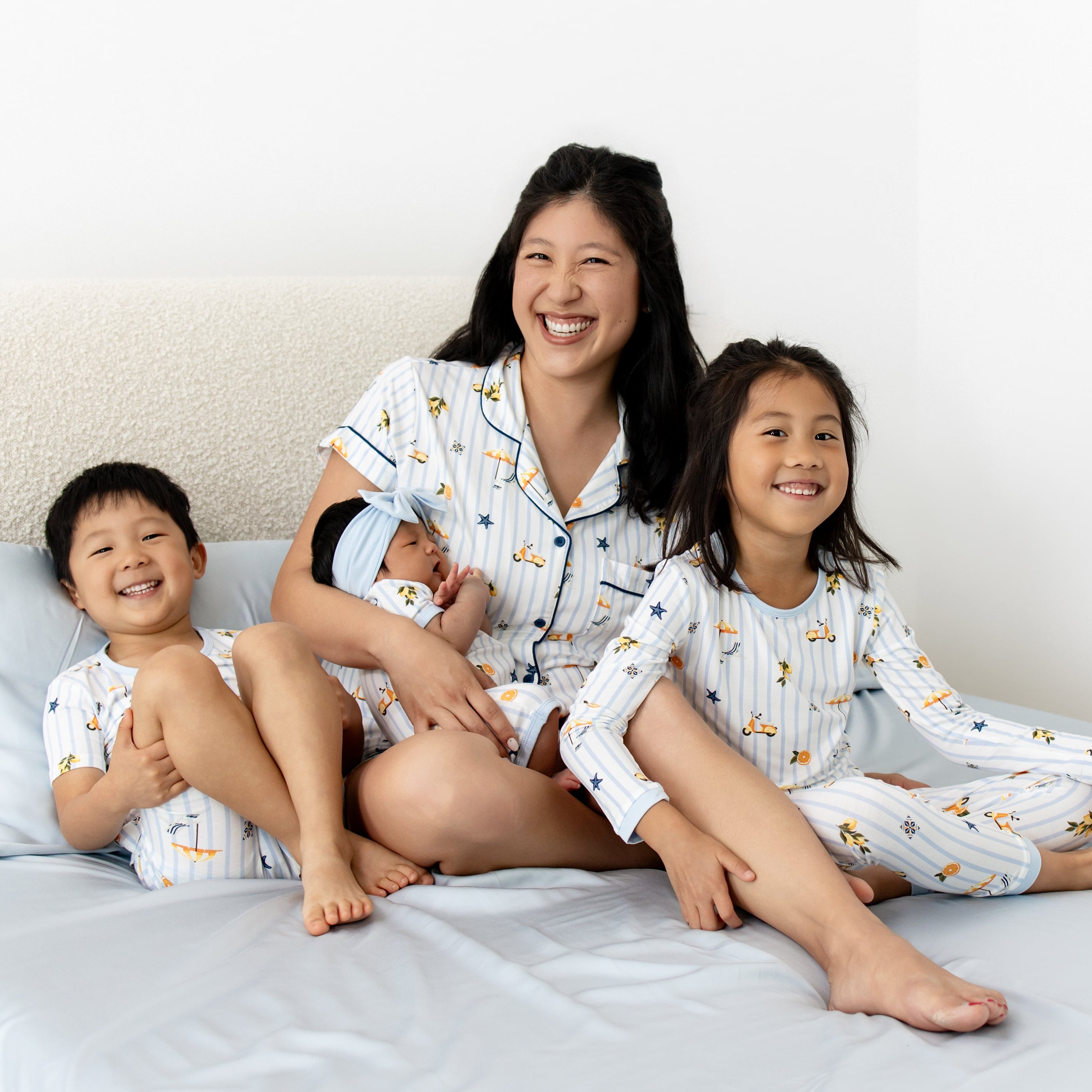 mom and kids wearing matching summer pajamas