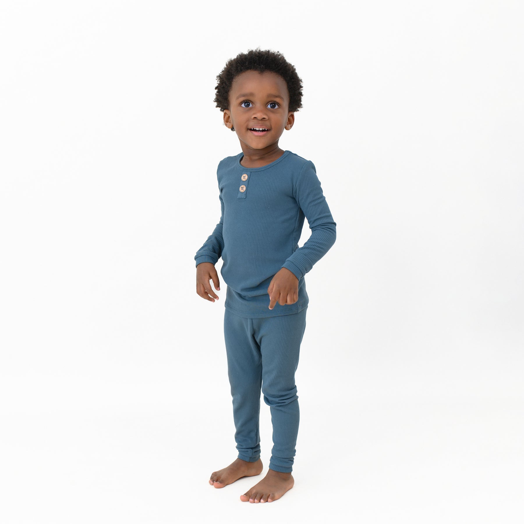Toddler standing wearing the Ribbed Henley Set in Atlantic in front of a white background