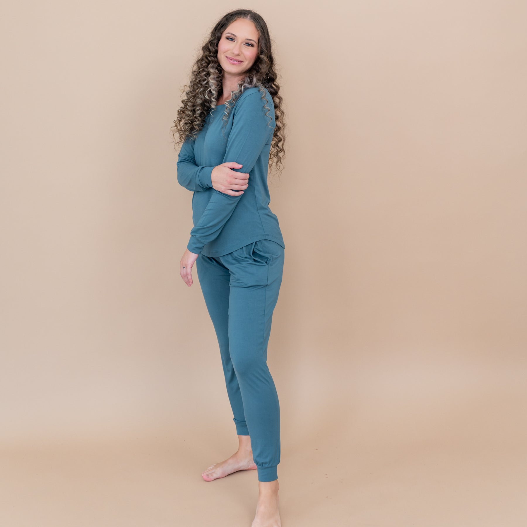 Female model showing the side view of the Women's Jogger Pajama Set in Atlantic