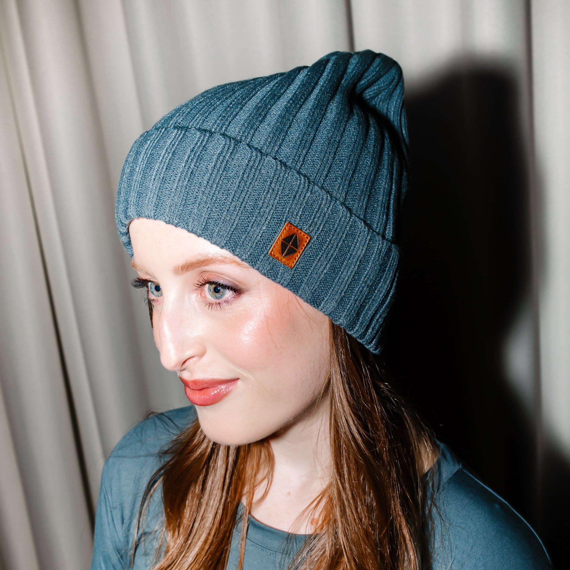 Chunky Knit Adult Ribbed Beanie in Atlantic shown on a female model