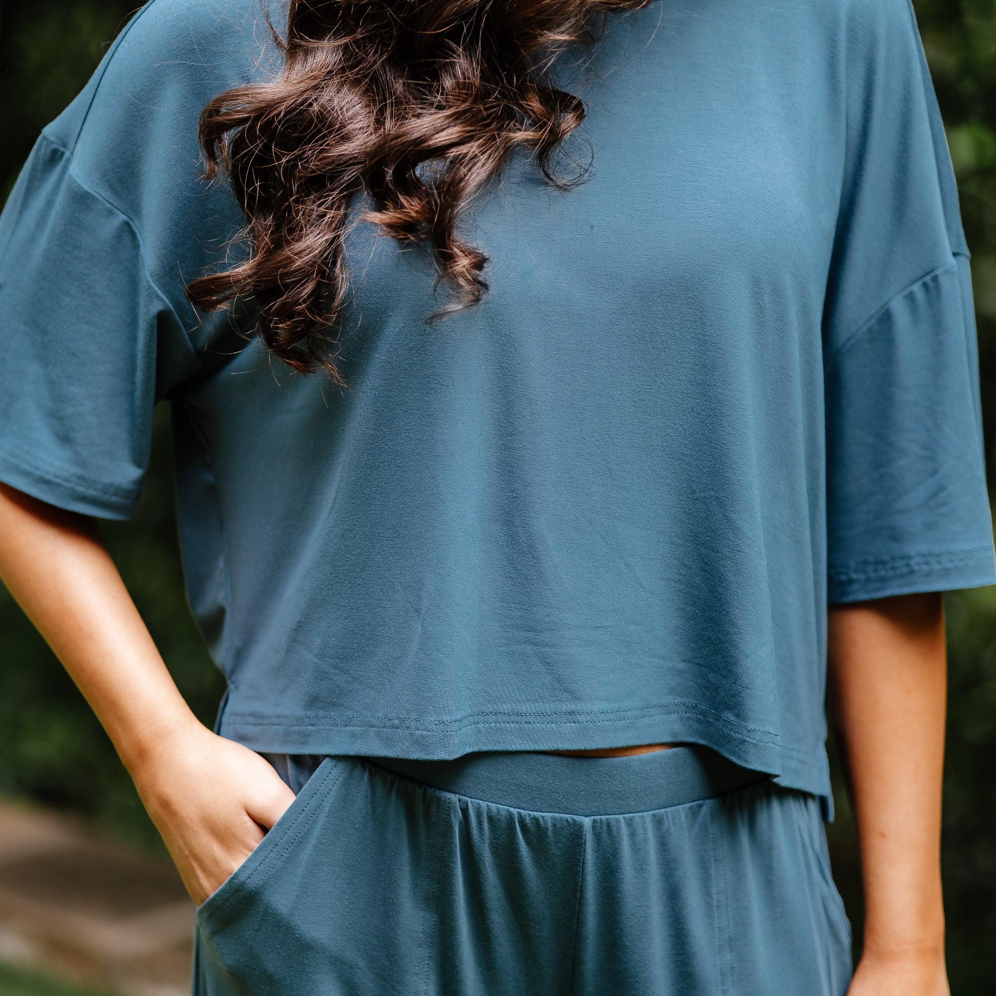 Close up of the Women's Short Sleeve Tee in Atlantic shown on a female model