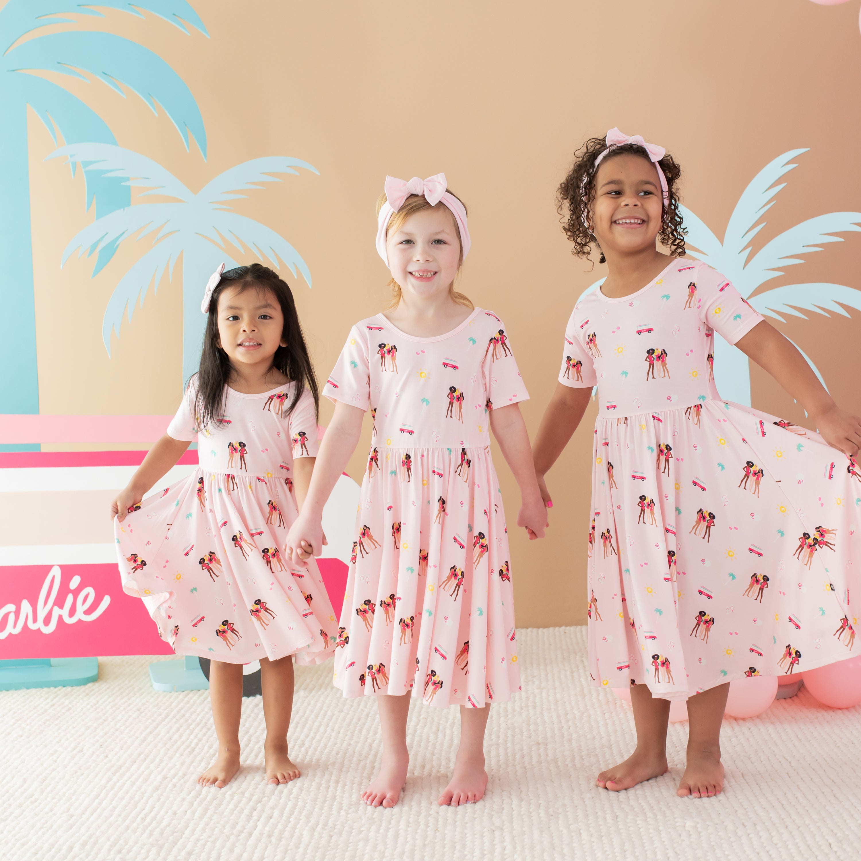 3 children modeling Twirl Dress in Barbie™ Beach