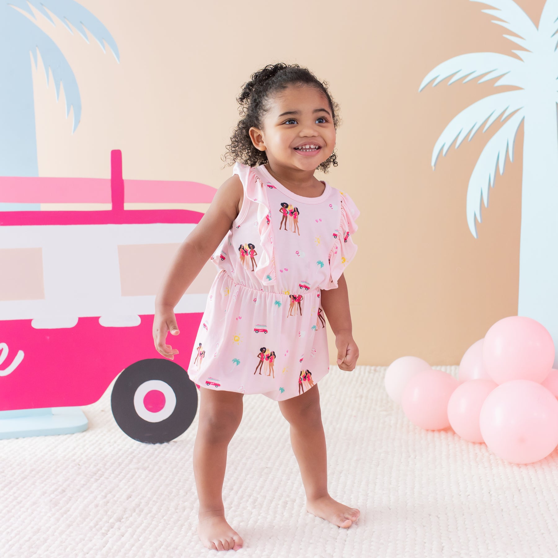 Toddler modeling Bubble Romper in Barbie™ Beach