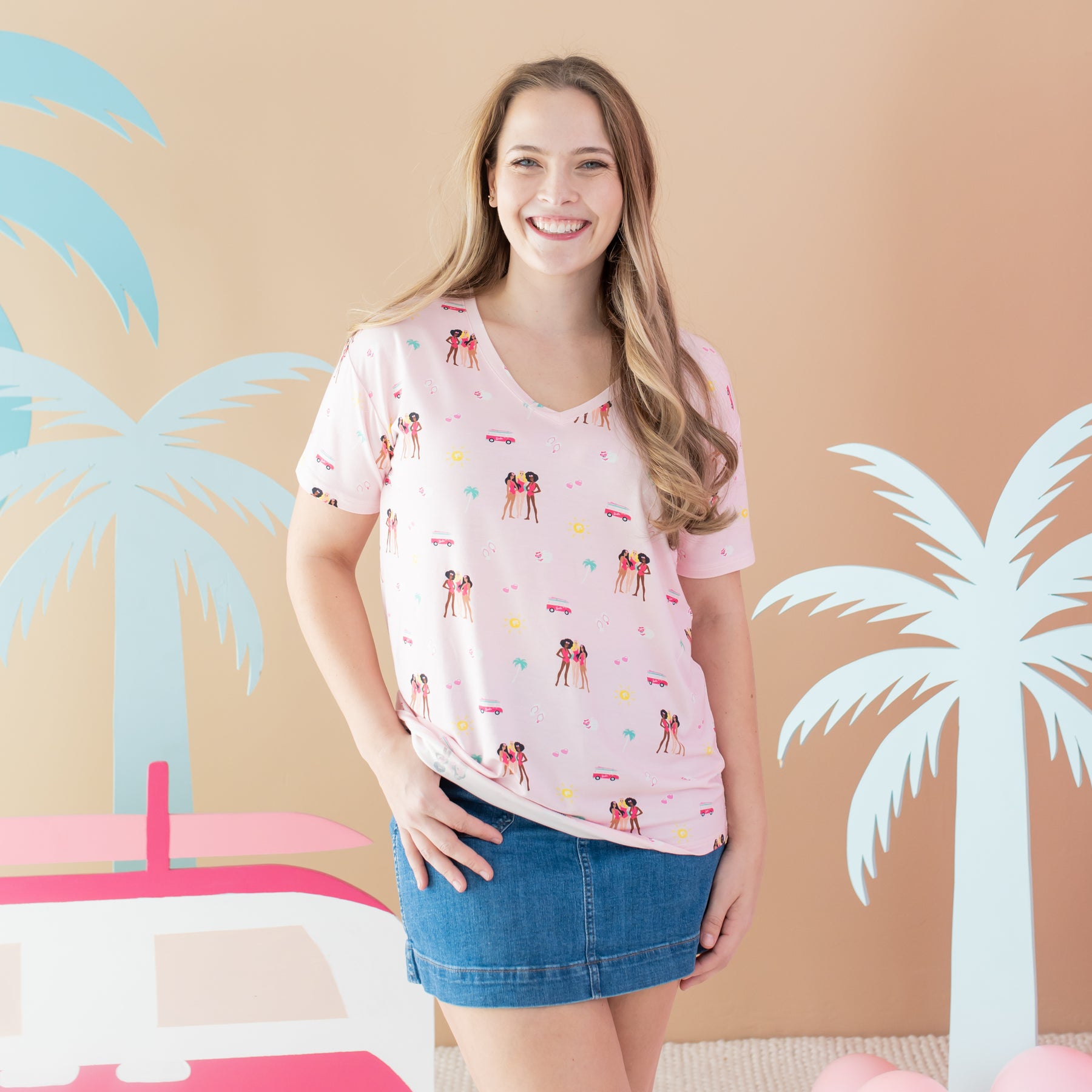 Woman modeling Women's V-Neck Tee in Barbie™ Beach