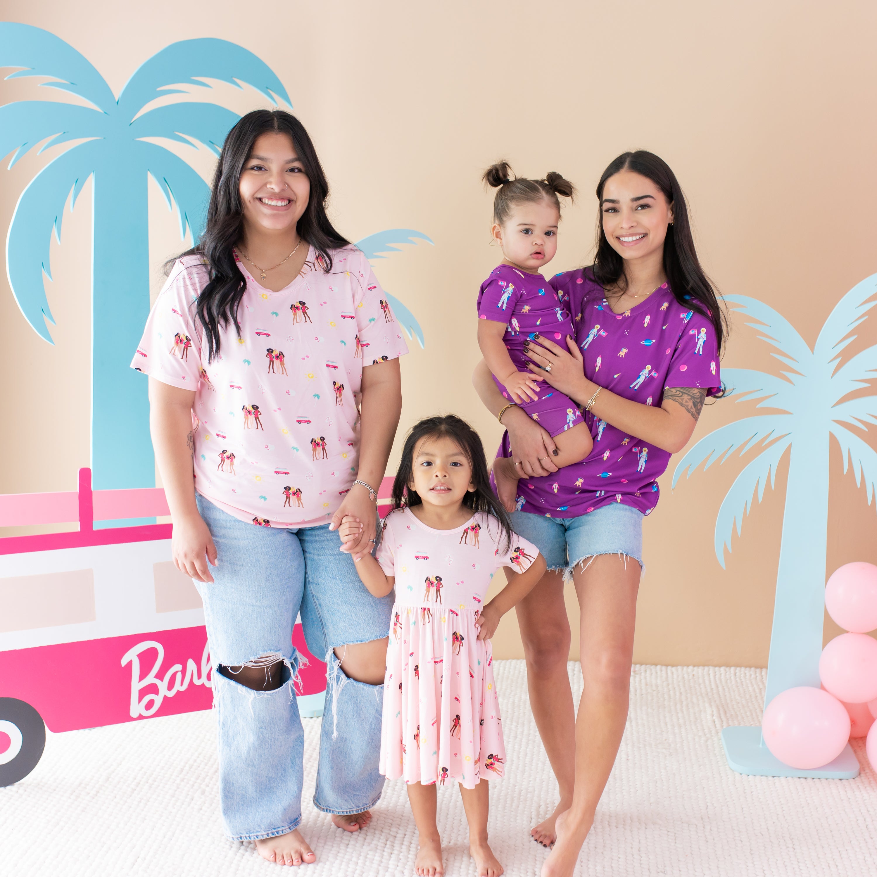 Group of moms and kids wearing Barbie™ Astronaut and Beach