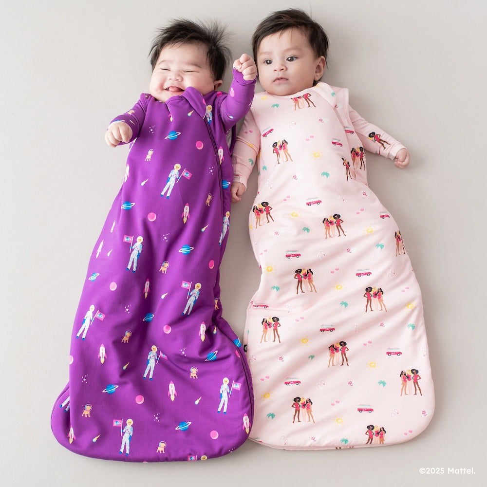 Two babies in Barbie sleep bags from Kyte Baby