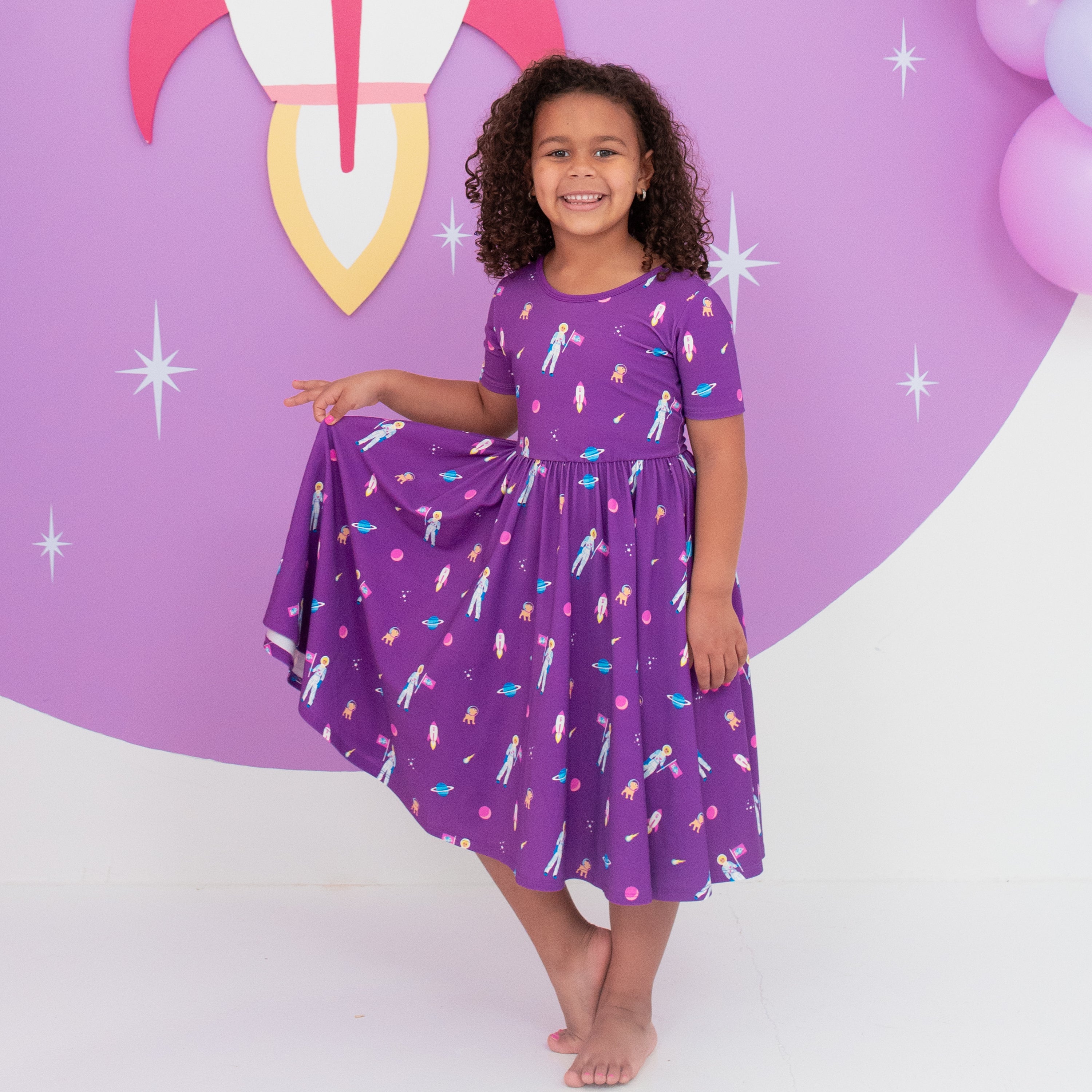 Child modeling Twirl Dress in Barbie™ Astronaut