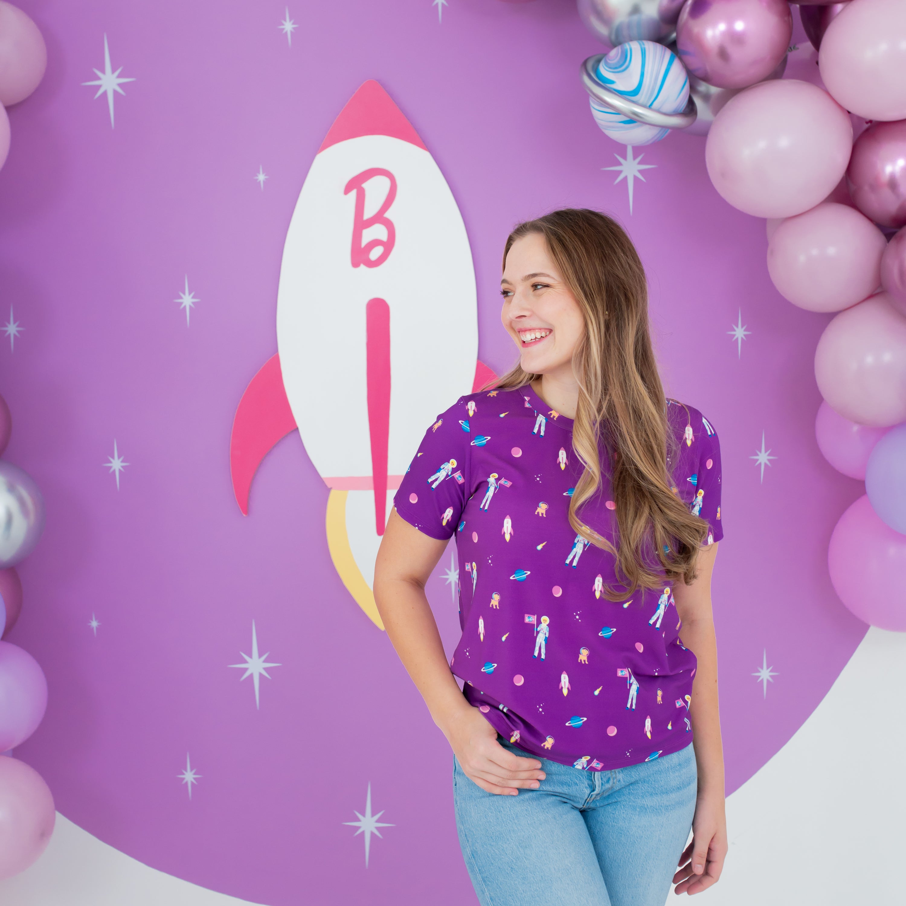 Woman modeling Women's Crew Neck Tee in Barbie™ Astronaut