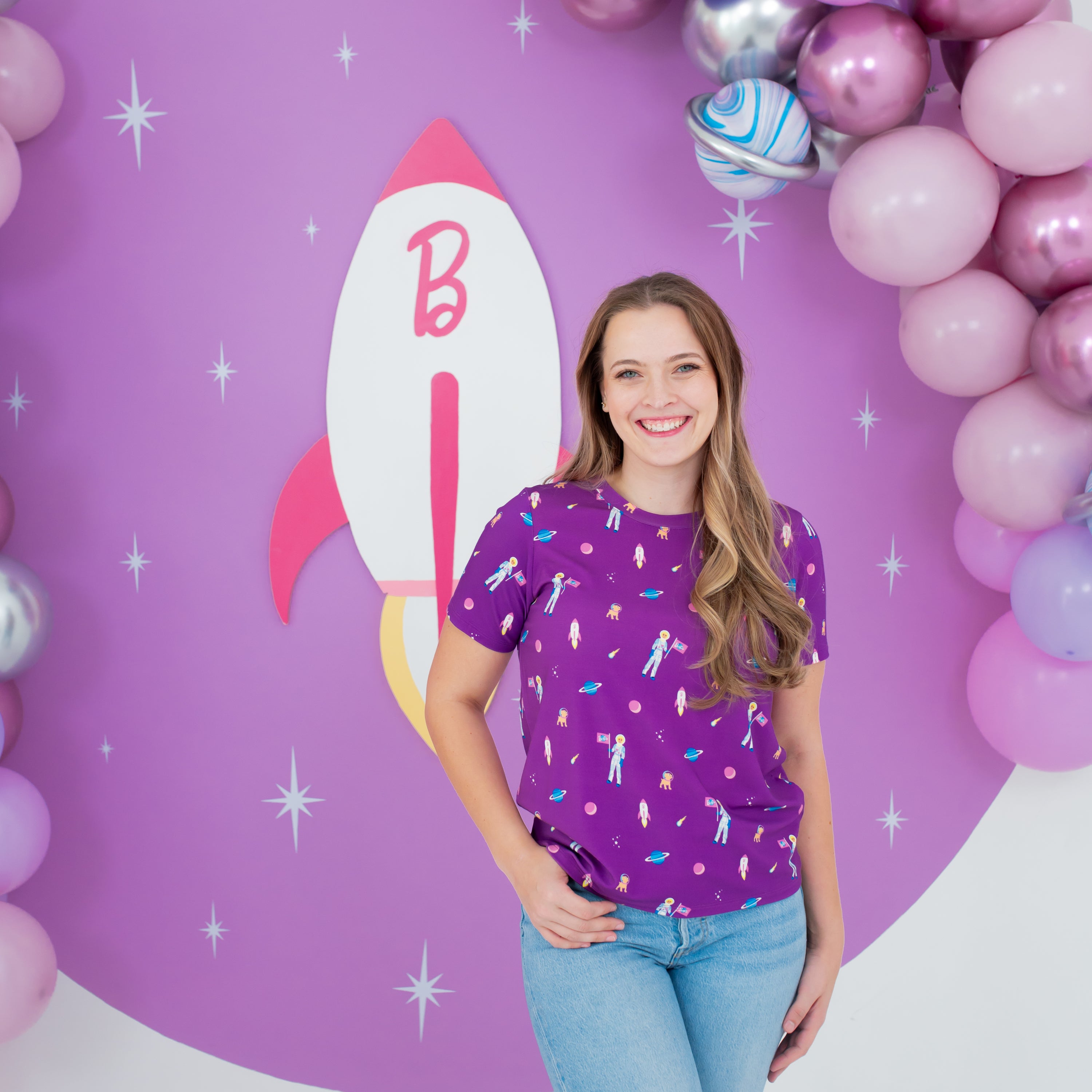 Woman modeling Women's Crew Neck Tee in Barbie™ Astronaut