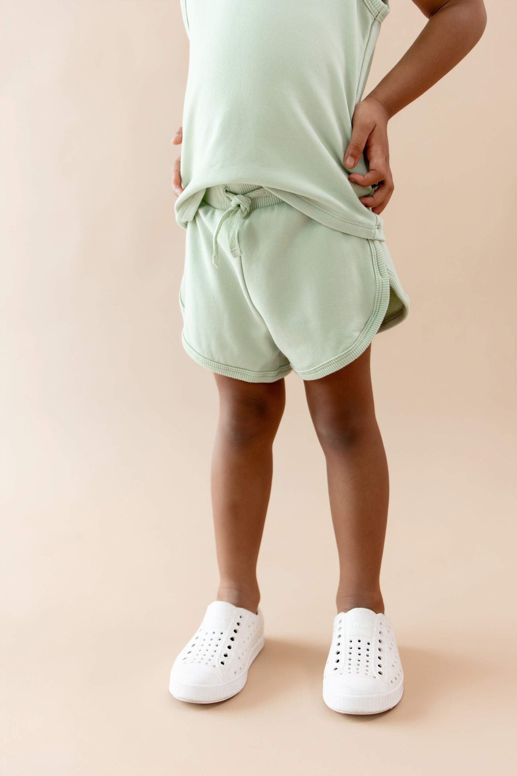 The shorts of the Tank Jogger Set in Basil shown on a model
