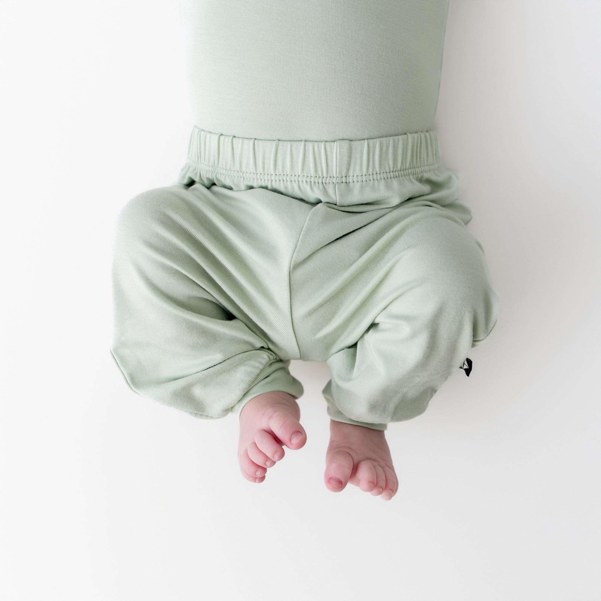 close up of the Pant in Basil on a newborn