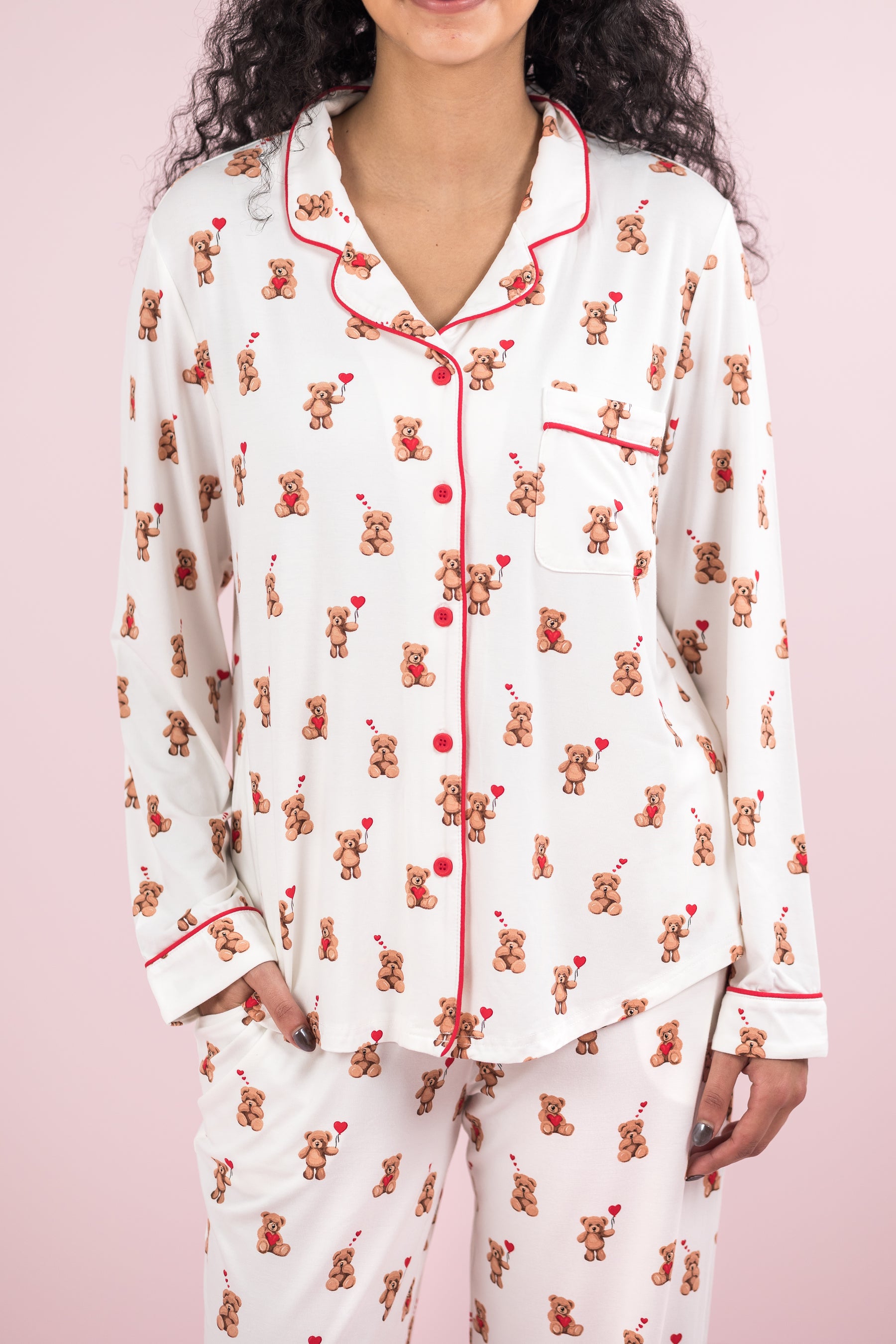 Close up of the button closures and red trim on the shirt of the Long-Sleeved Women's Pajama Set in Bear Hearts