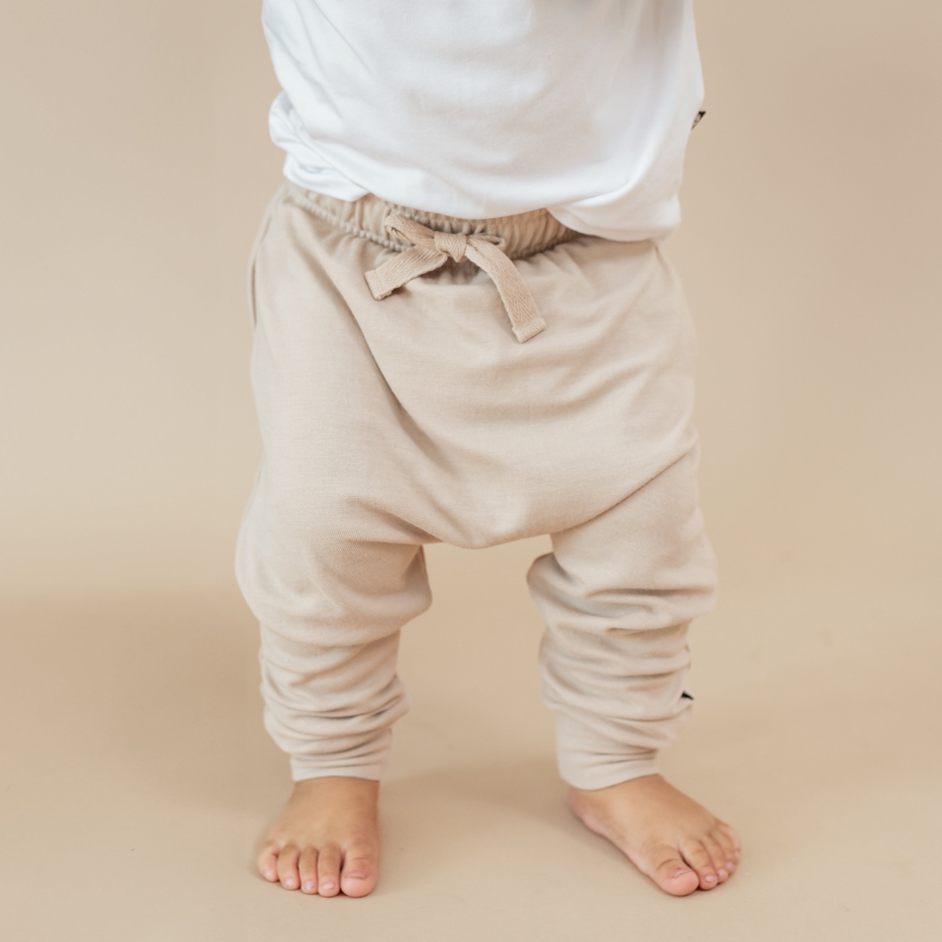 Bamboo Jersey Harem Pants in Bisque shown on a toddler model