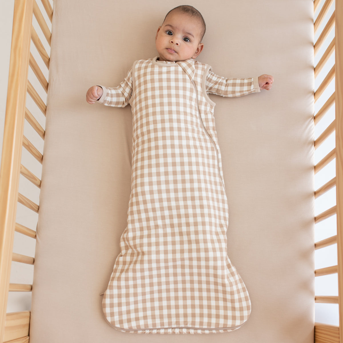 Infant wearing Sleep Bag in Gingham Bisque 1.0 TOG and matching long sleeve pajamas