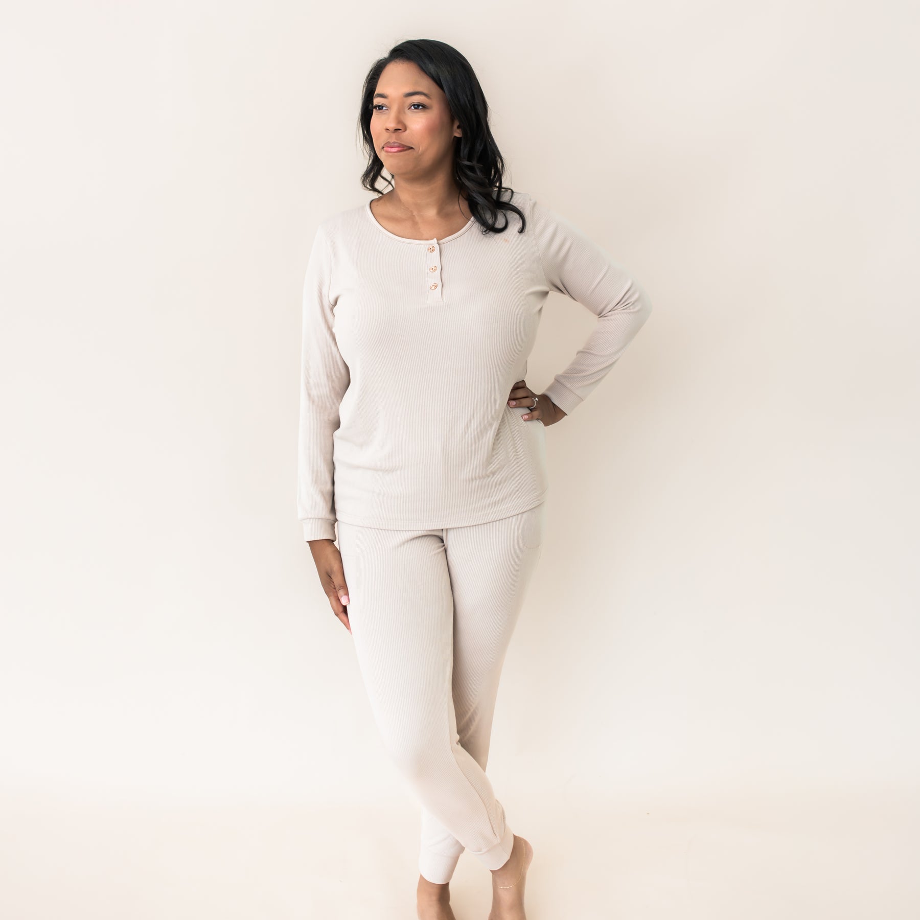 Female standing with one hand on hip wearing the Women’s Ribbed Henley Set in Bisque