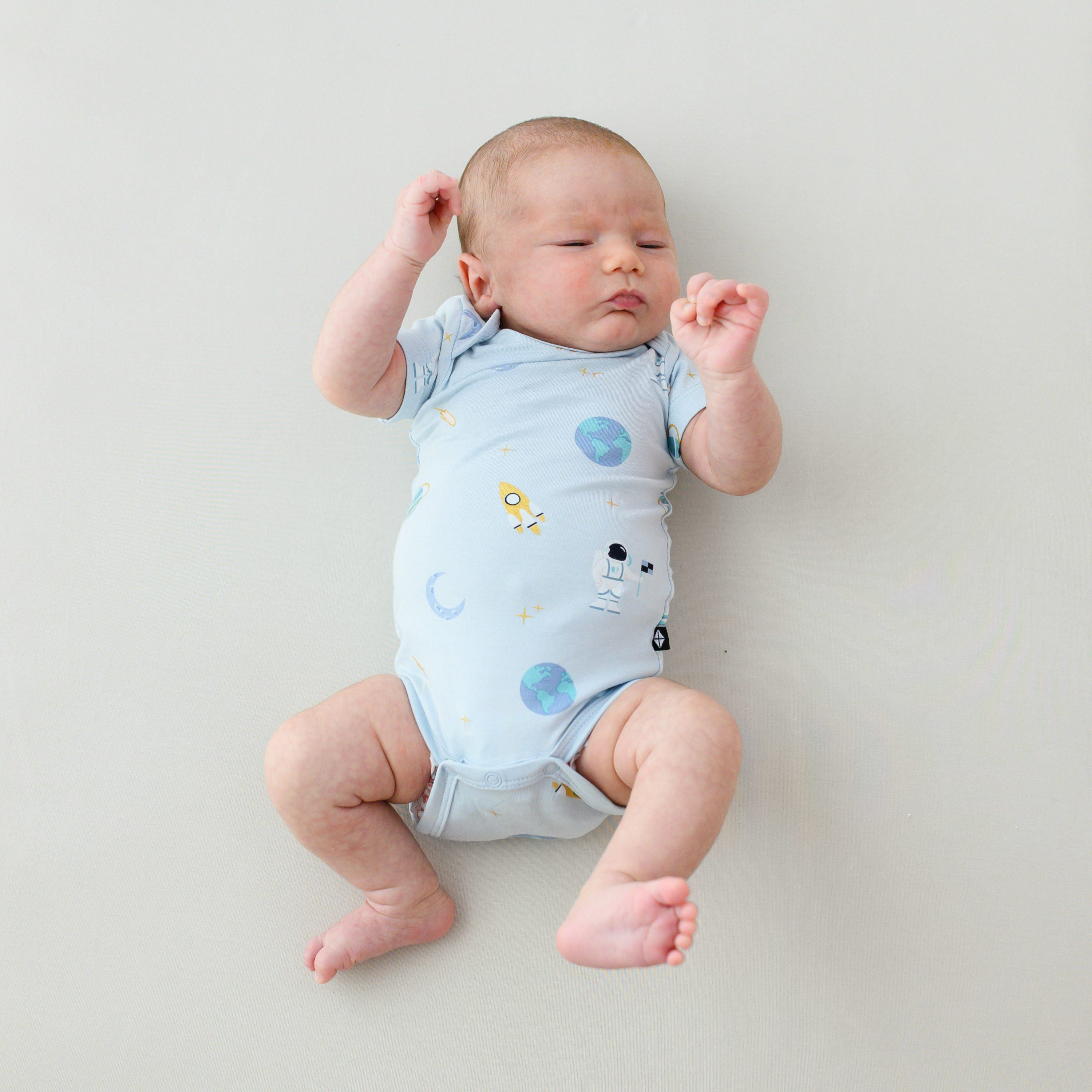 baby in short sleeve ice space bodysuit