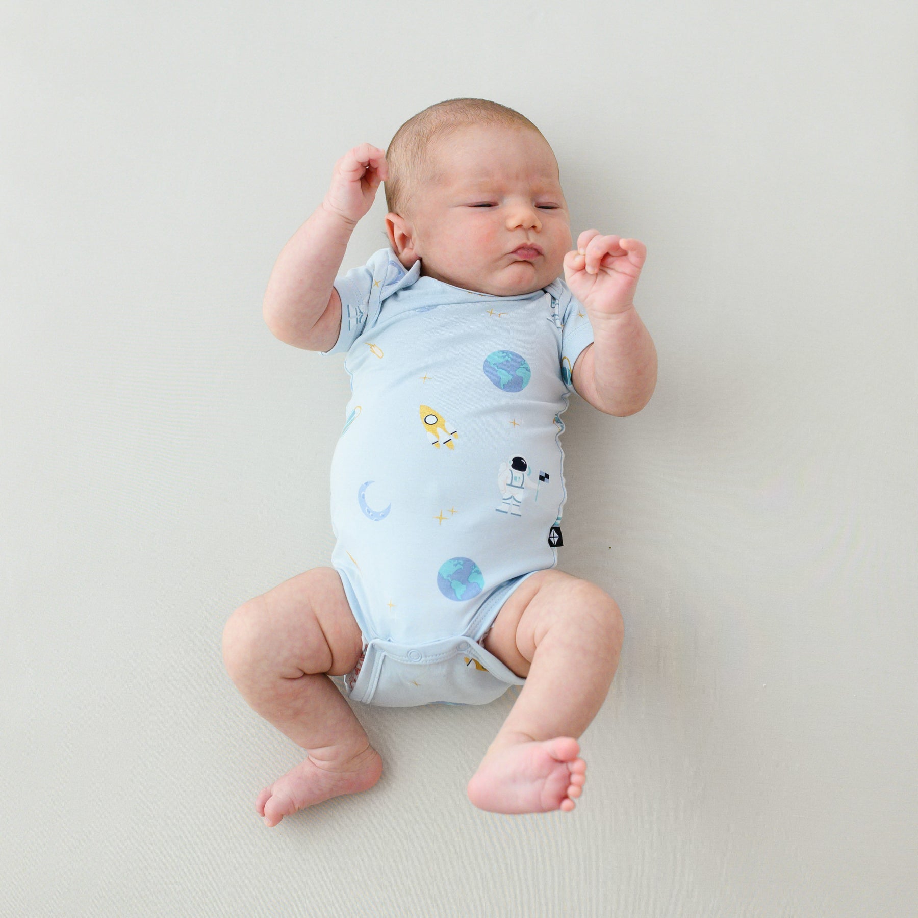 baby in short sleeve ice space bodysuit