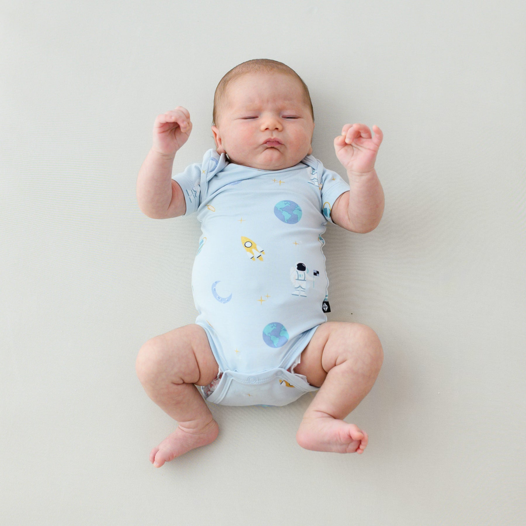 baby in short sleeve ice space bodysuit