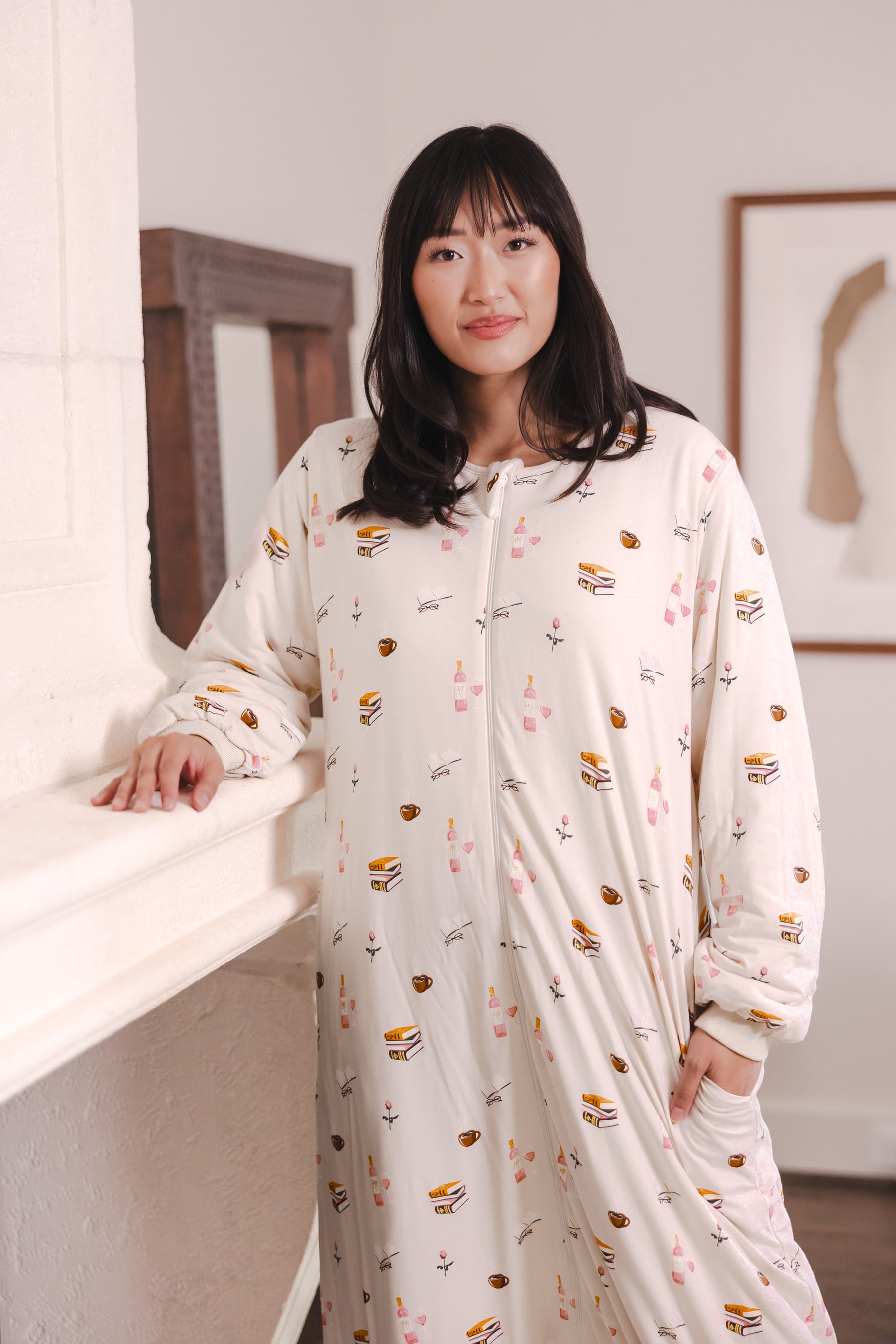 Modal standing wearing Beige Long Sleeve Adult Sleep Bag Walker in Book Club print