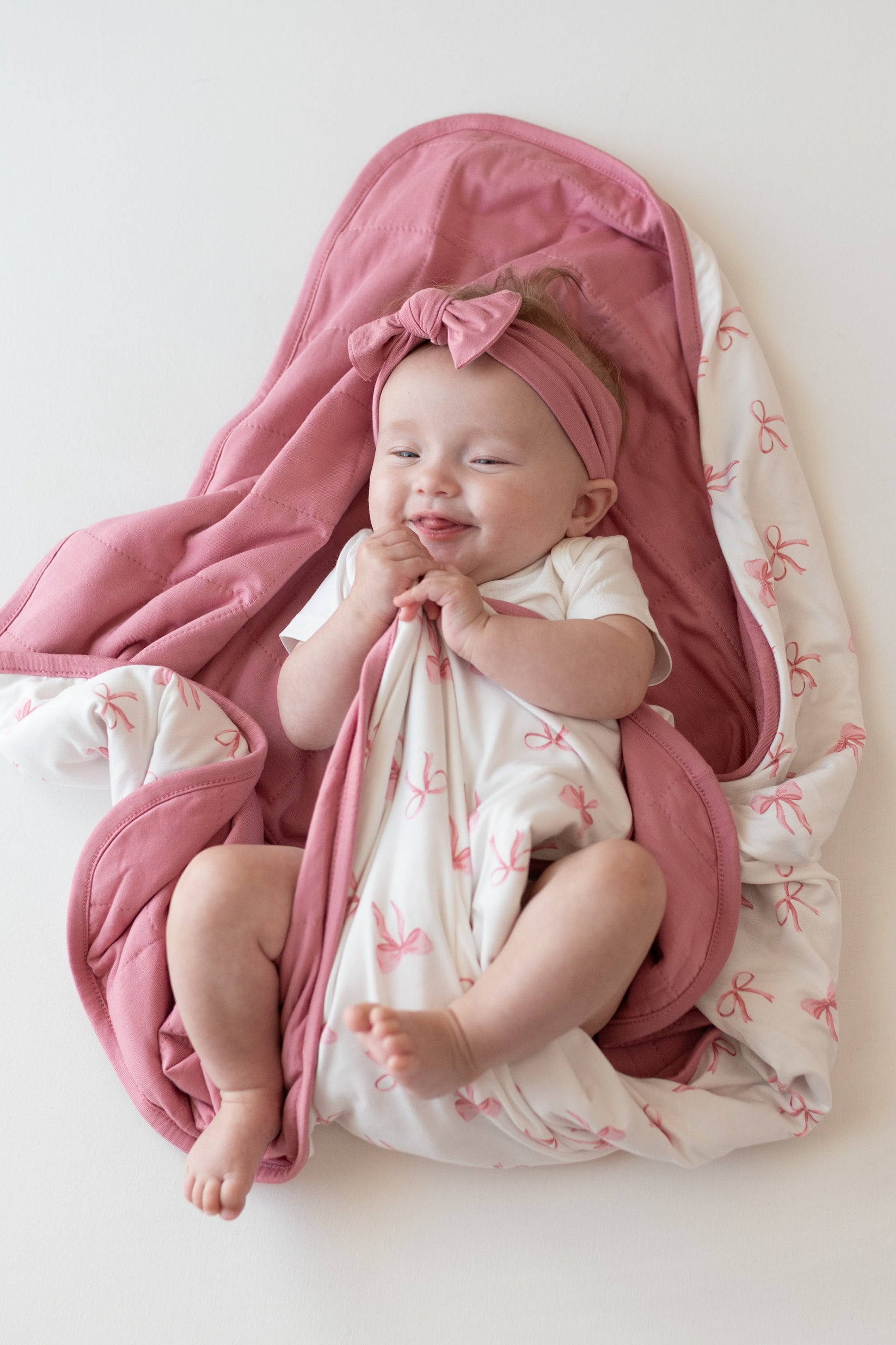 Baby wrapped in Baby Blanket in Bow 1.0 TOG