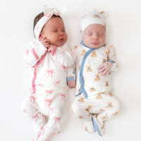 Two babies in take me home sets