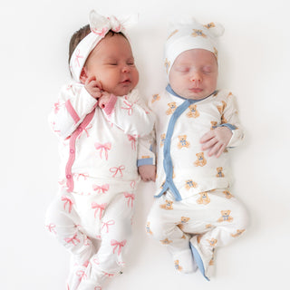 Two babies in Lulla Babys take me home sets
